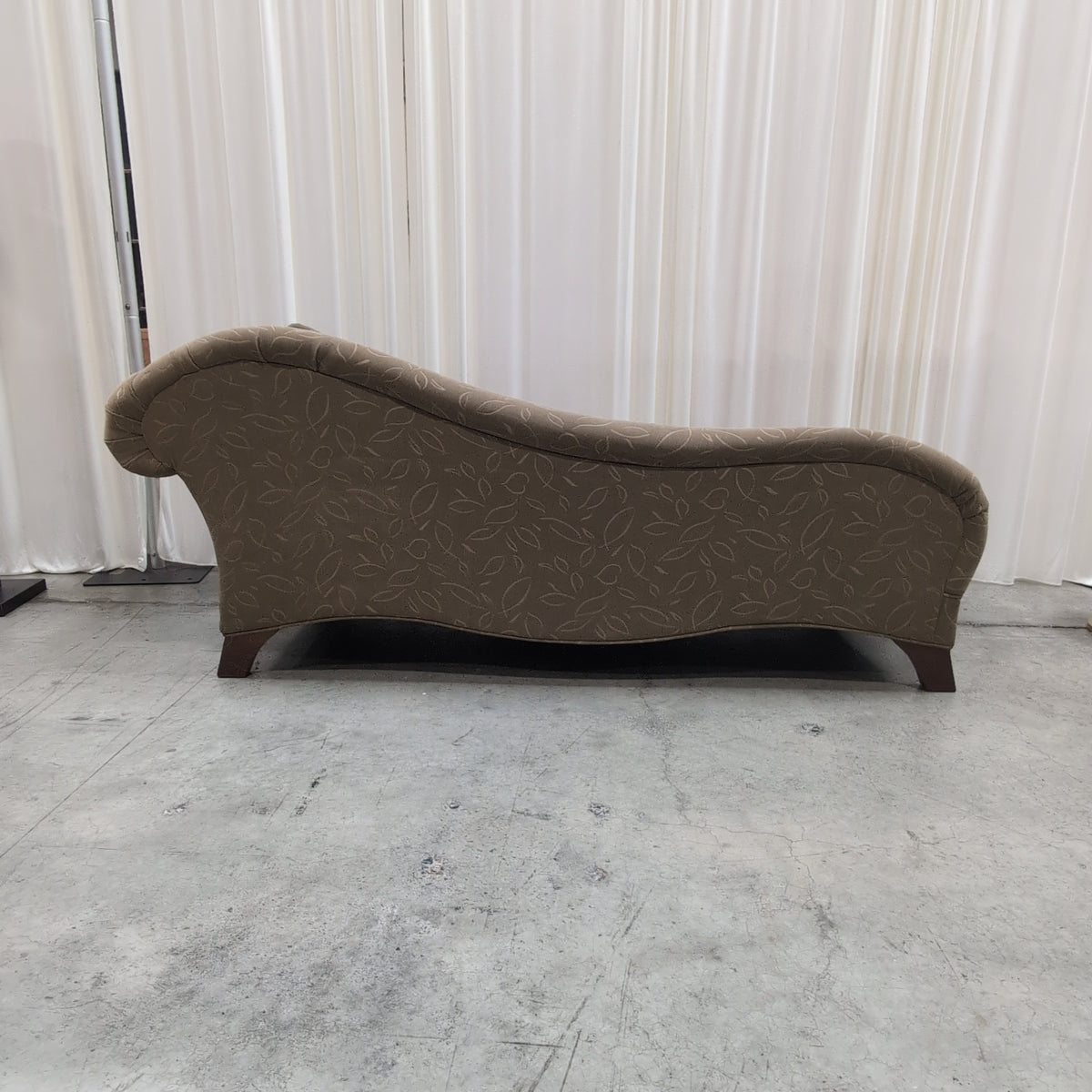 Tan Upholstered Chaise Lounge with Leaf Pattern