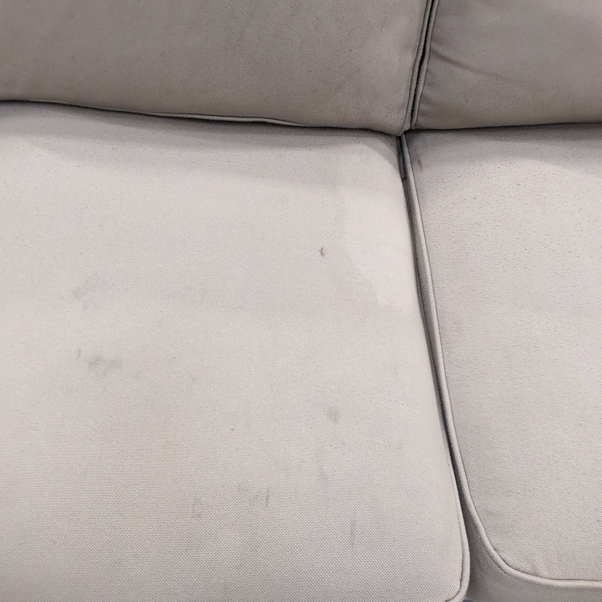 Tan Fabric Three-Cushion Couch with Rolled Arms