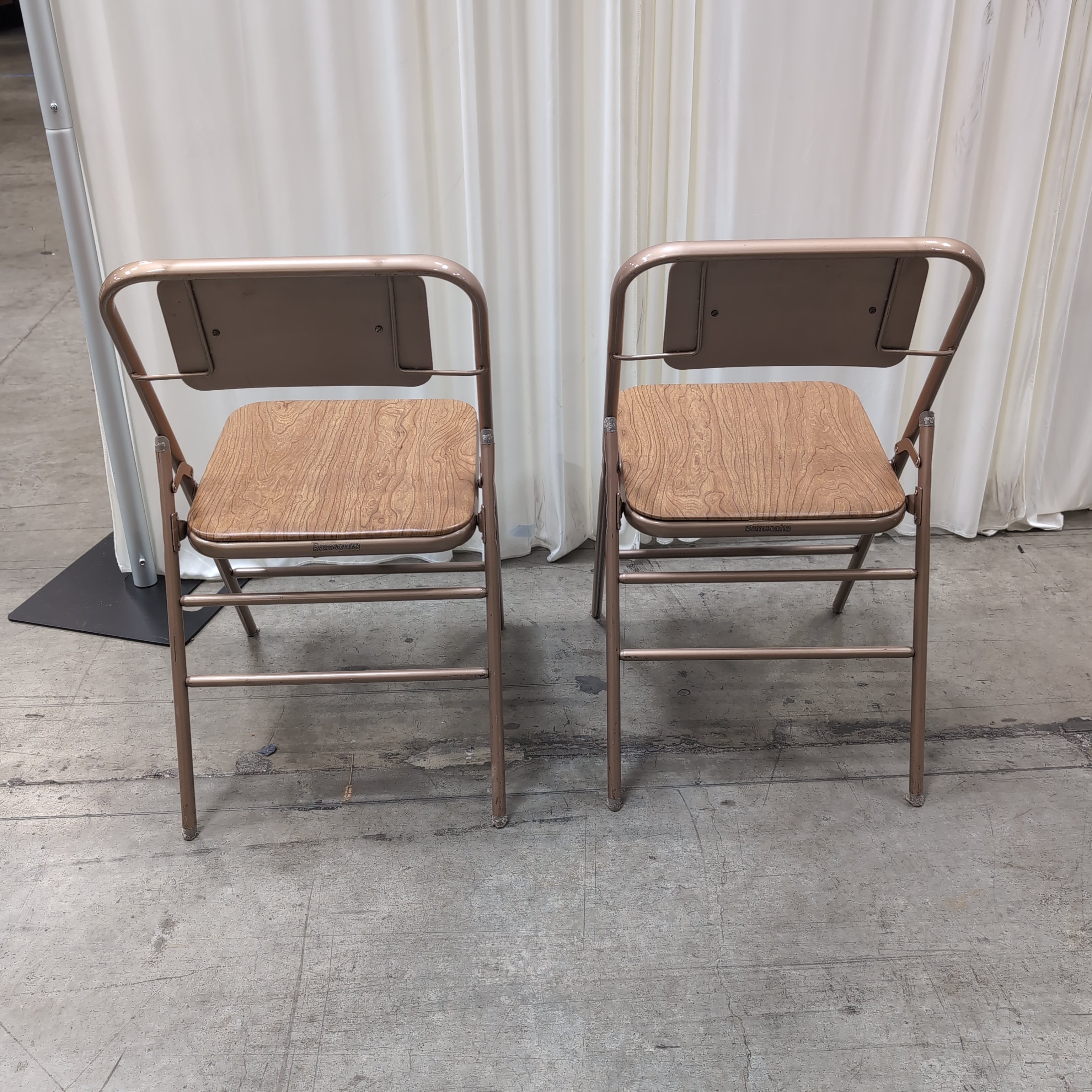 Pair of Bronze Metal Folding Chairs with Wood-Look Seats