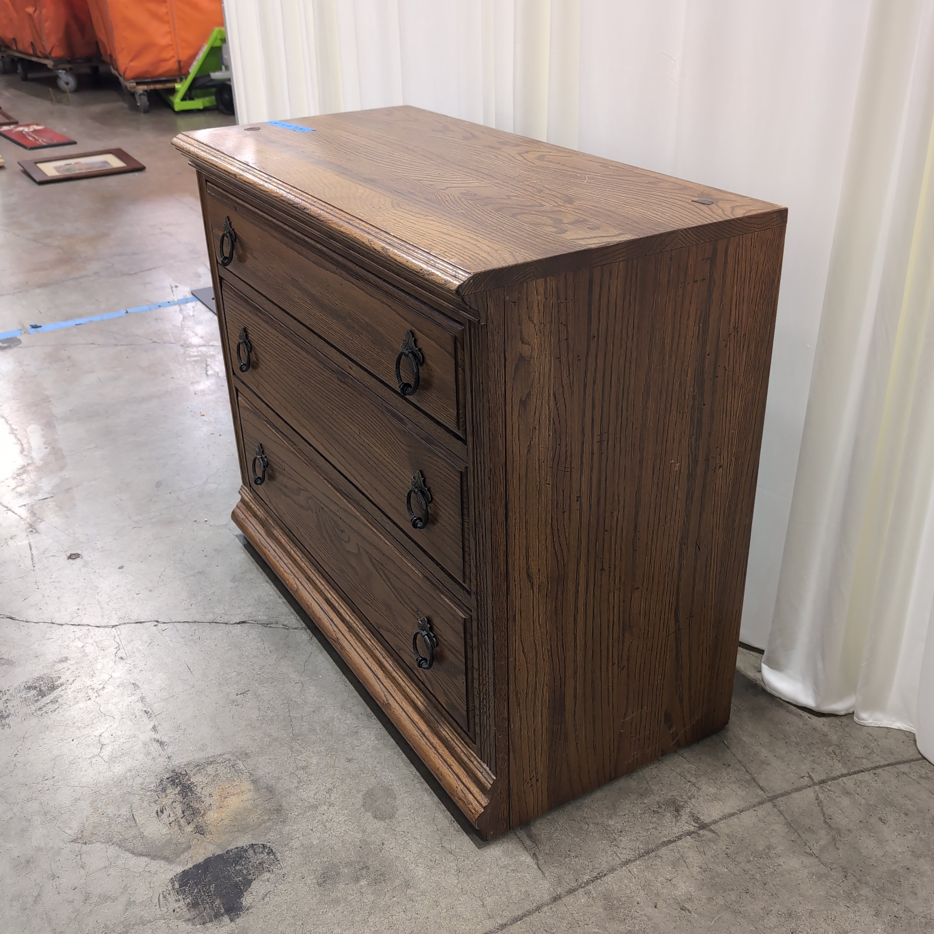 Traditional Brown Wood Three-Drawer Dresser with Ornate Hardware