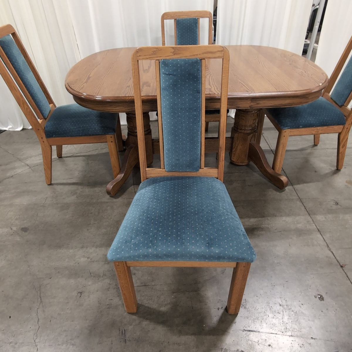 Reddish Brown Oval Pedestal Dining Table