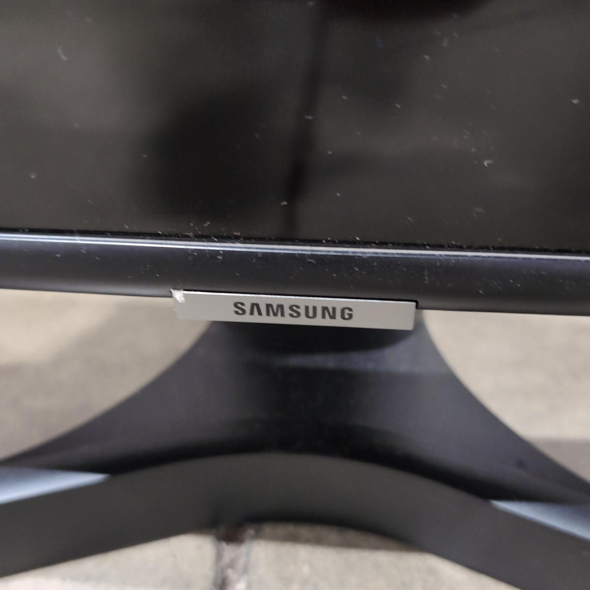 Samsung-Black Flat Screen Television with Stand