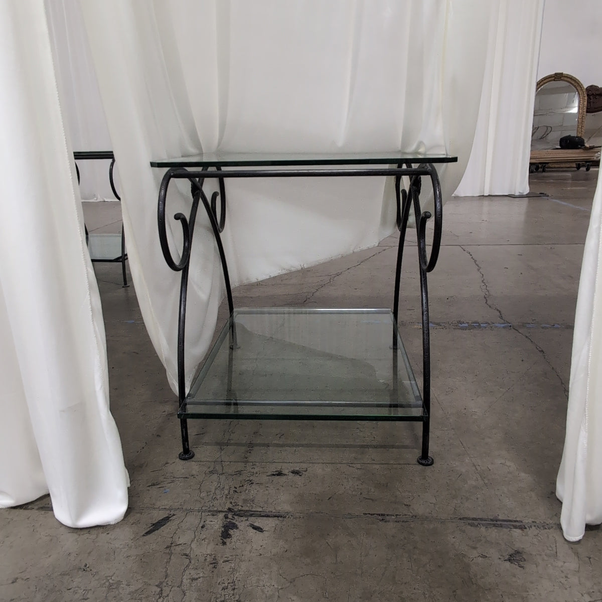 Dark Metal Two-Tiered End Table with Glass Shelves