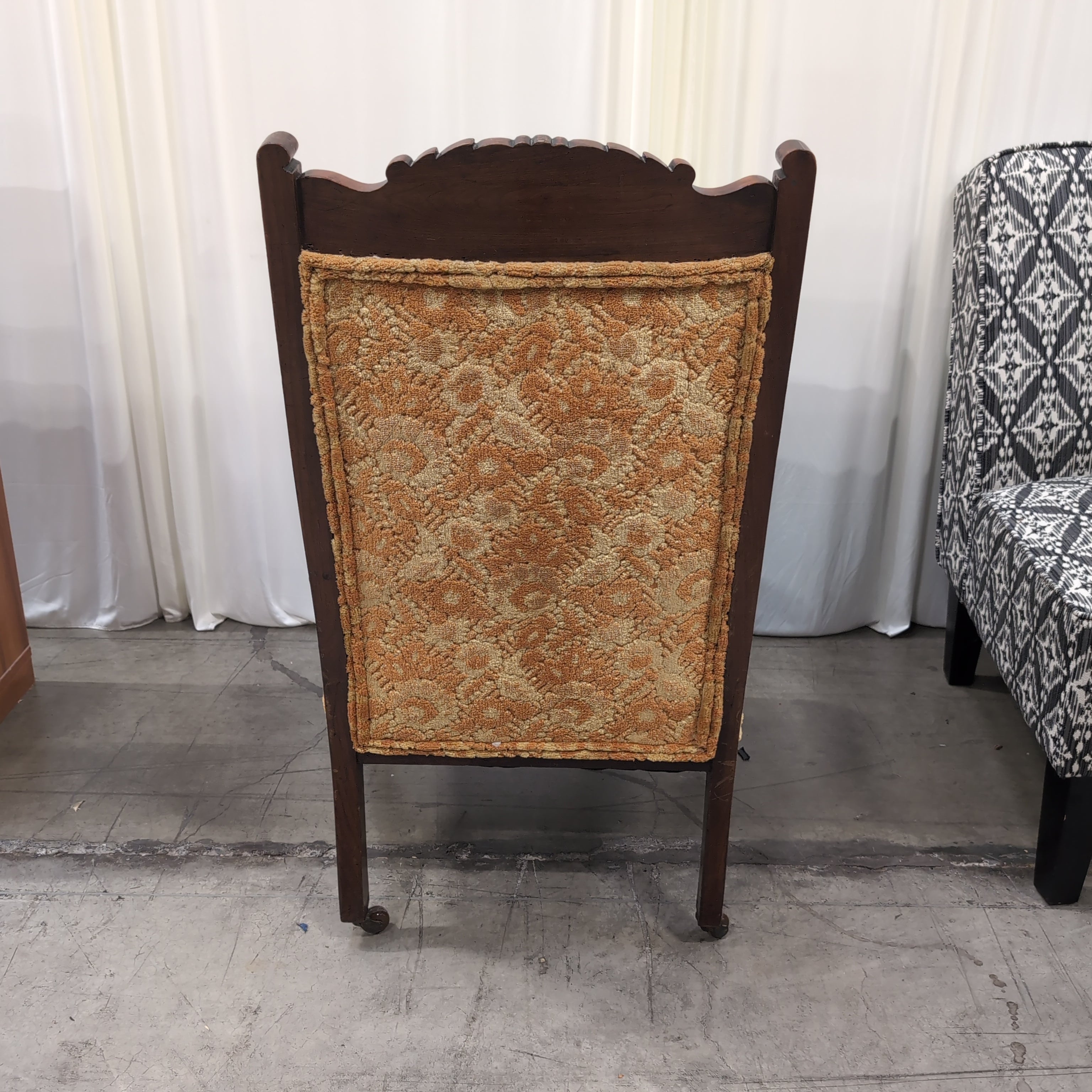 Carved Dark Wood Accent Chair with Patterned Upholstery