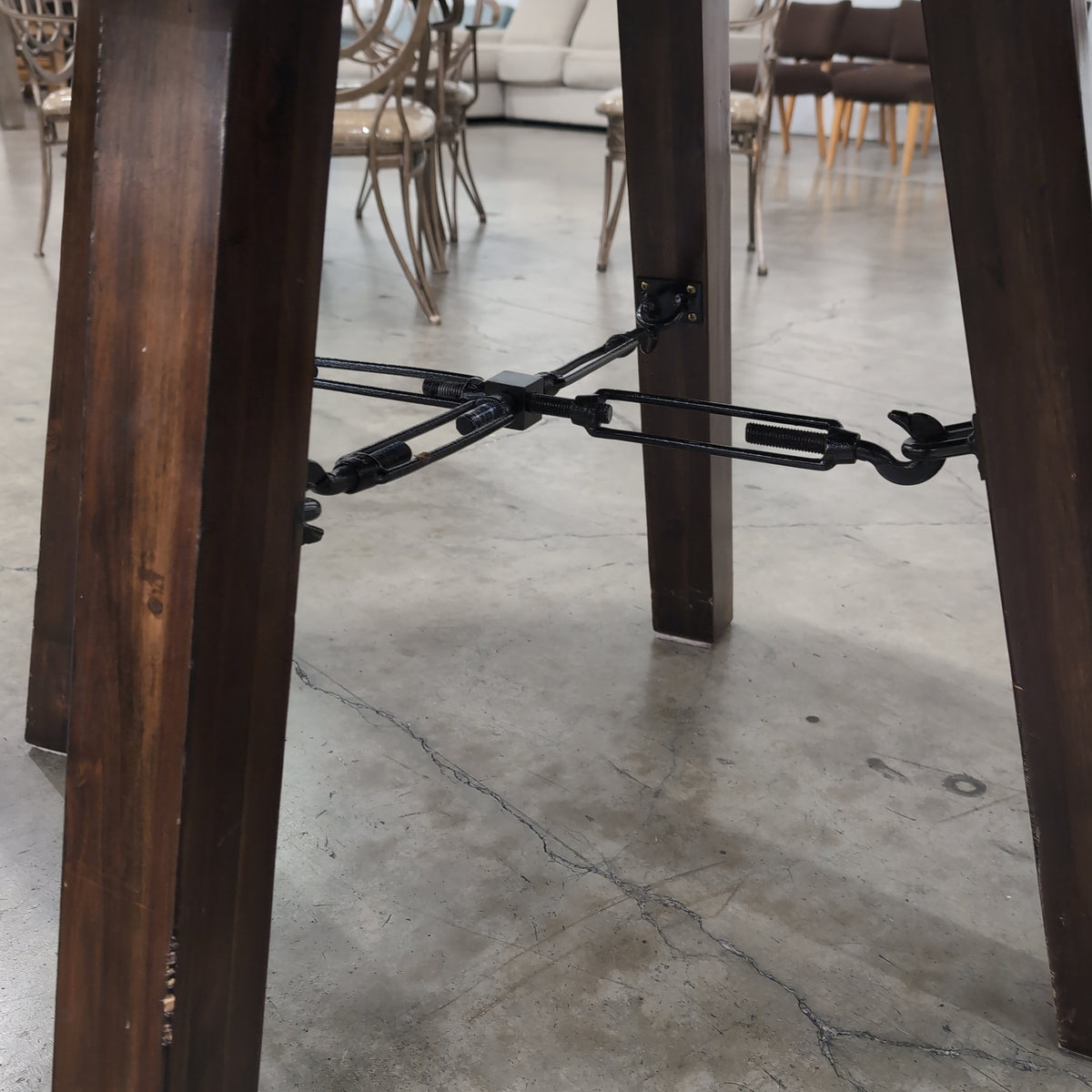 Rustic Dark Wood Round Dining Table with Metal Accents