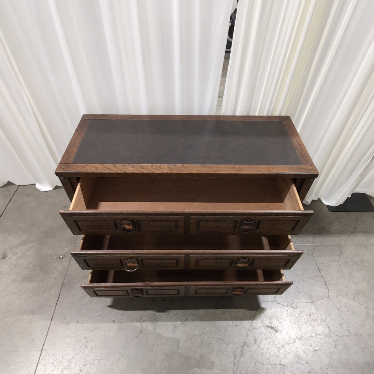 Traditional Dark Wood Four-Drawer Dresser with Ornate Pulls