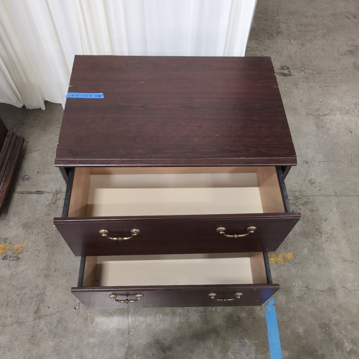 Dark Wood Two-Drawer Dresser with Ornate Hardware