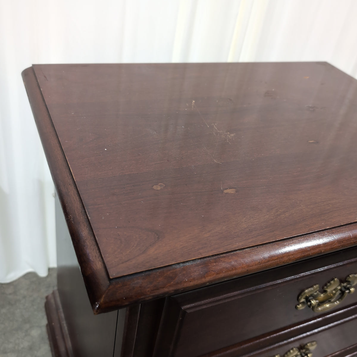 Dark Cherry Wood Nightstand with Ornate Hardware