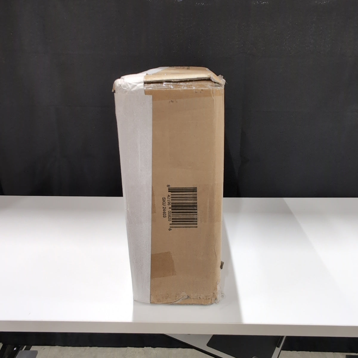 Unknown Item in Sealed Cardboard Box