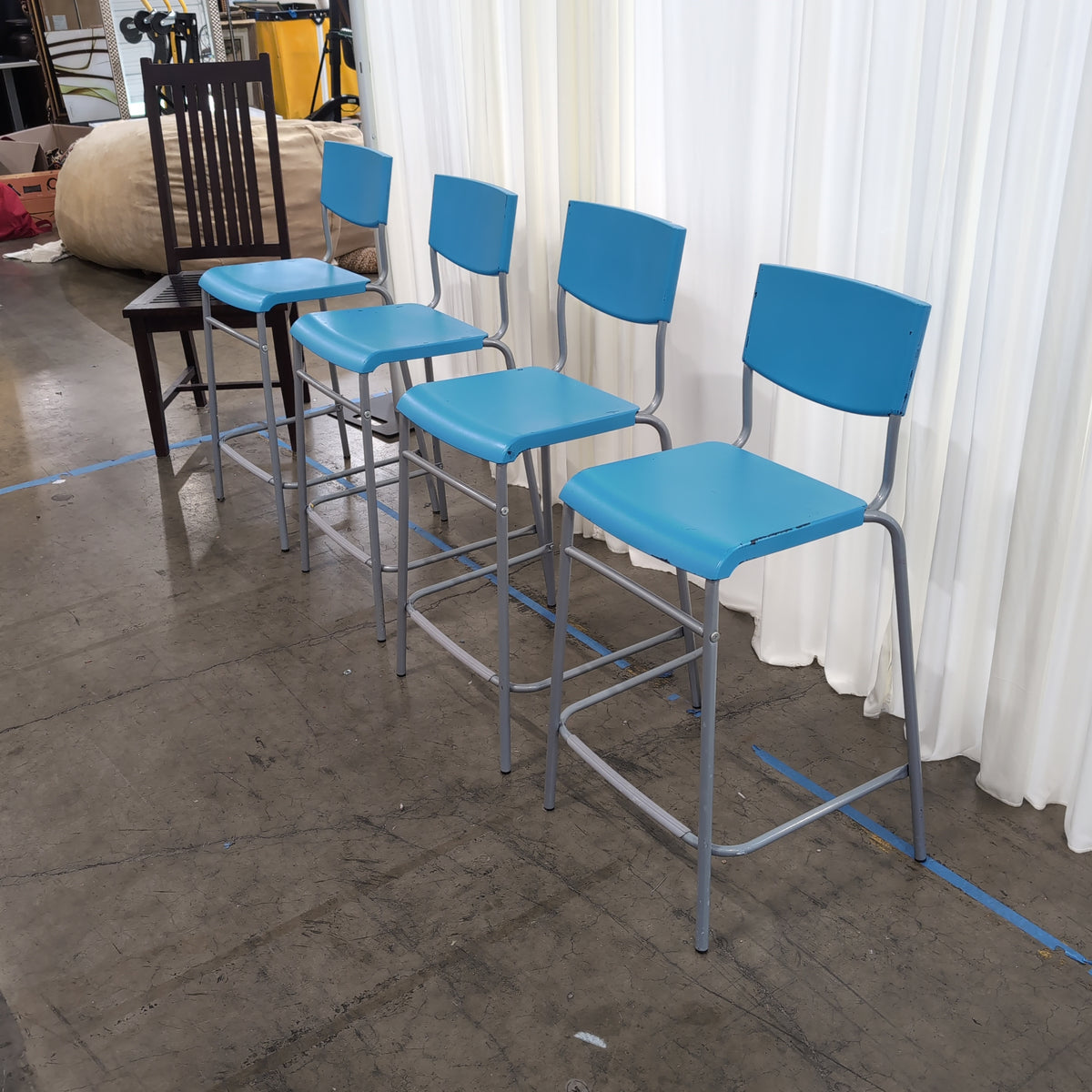Set of Four Stackable Blue Plastic Chairs