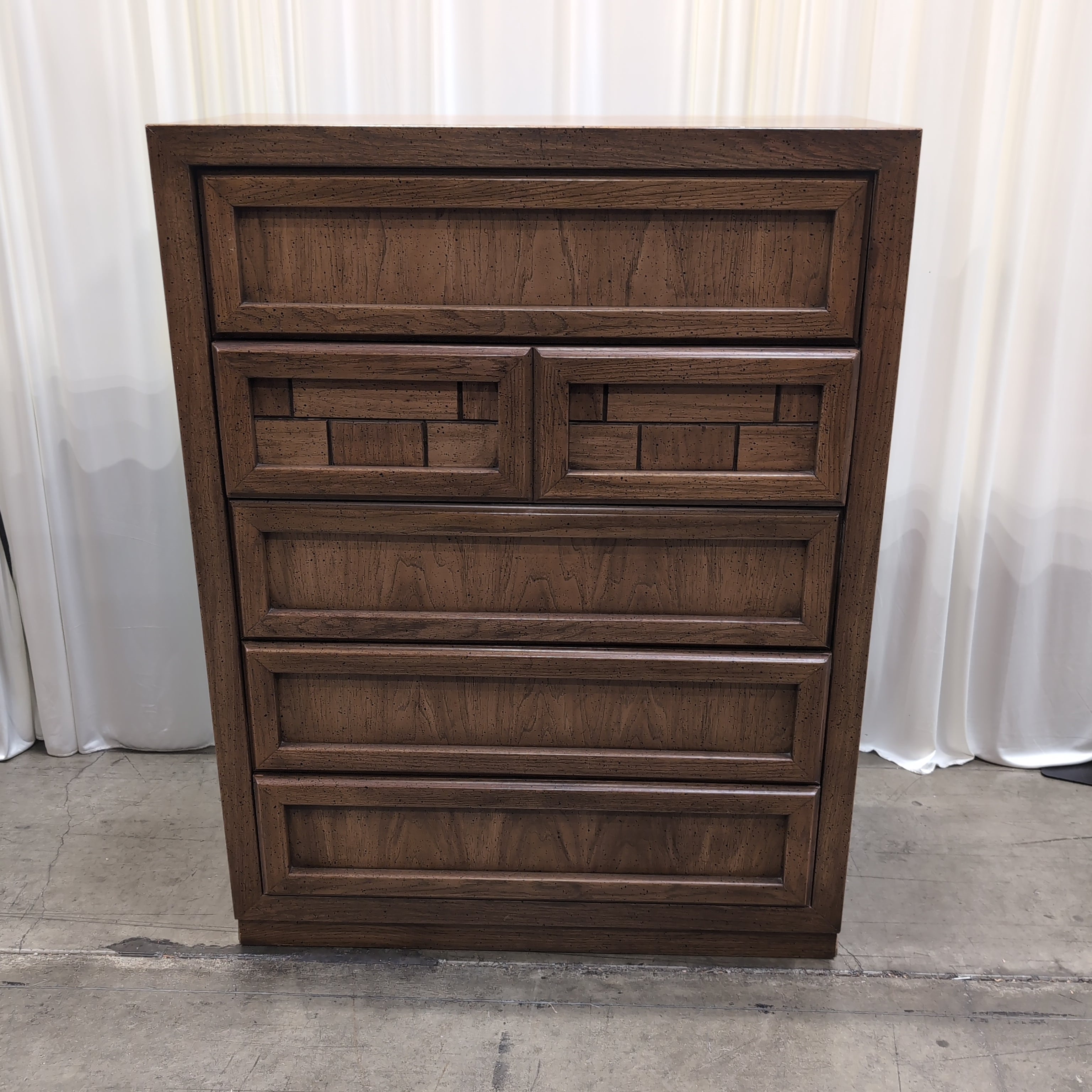 Honey Wood Five-Drawer Dresser with Geometric Top Panels