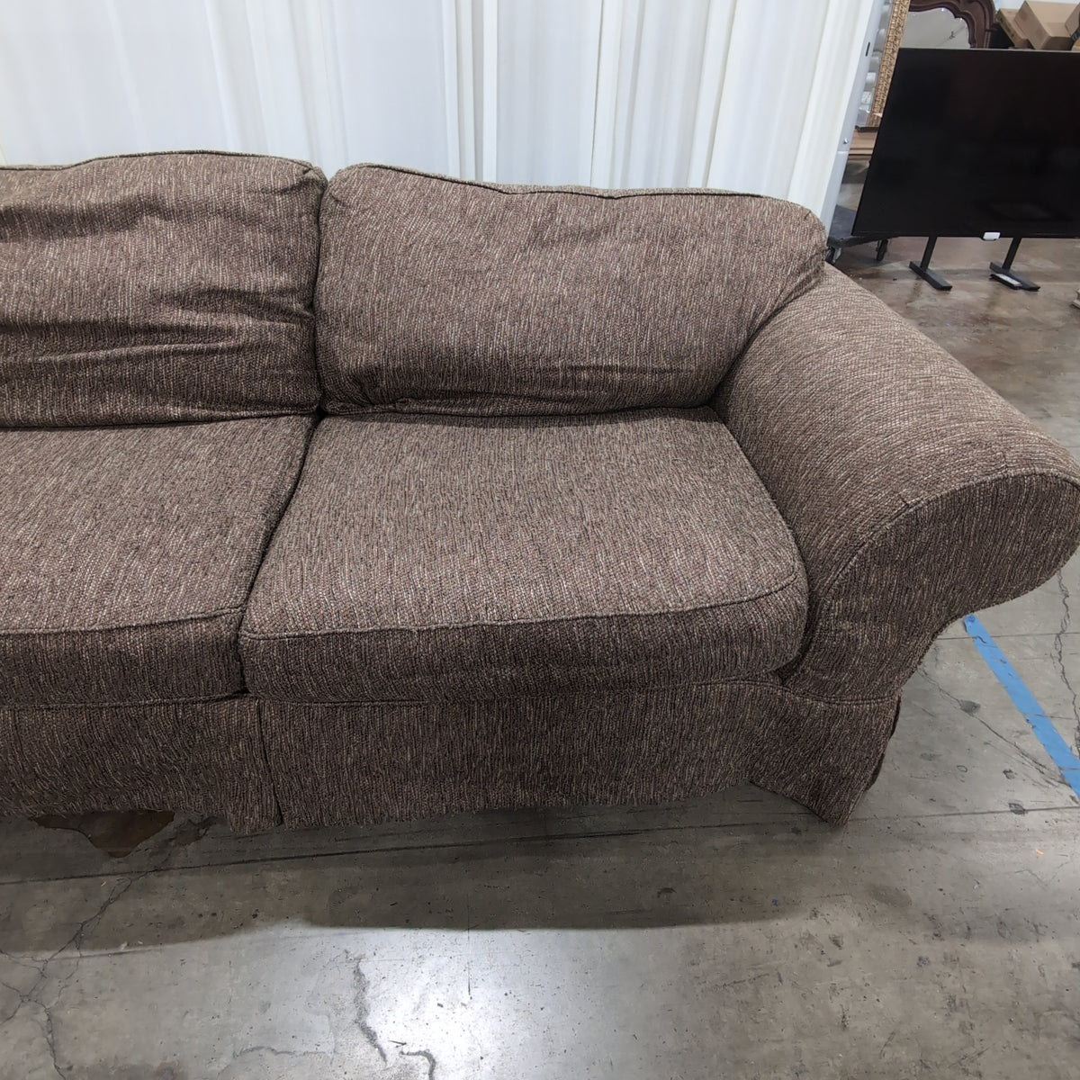 Textured Brown Rolled Arm Couch with Skirted Base
