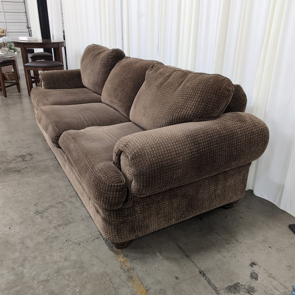 Brown Rolled Arm Three-Cushion Couch in Textured Fabric