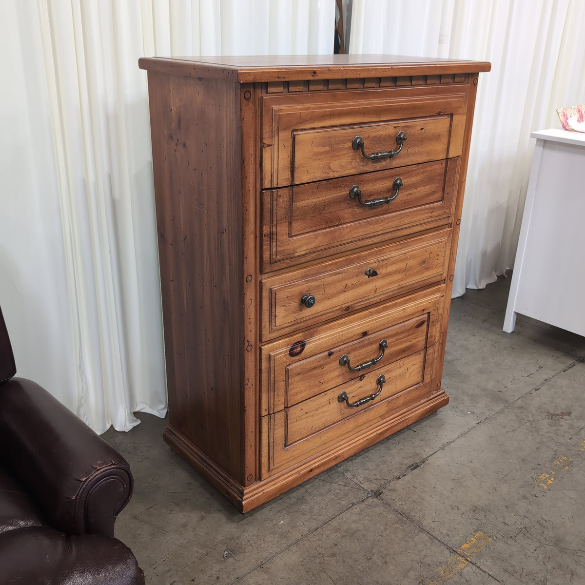Honey-Toned Wood Four-Drawer Dresser with Decorative Molding