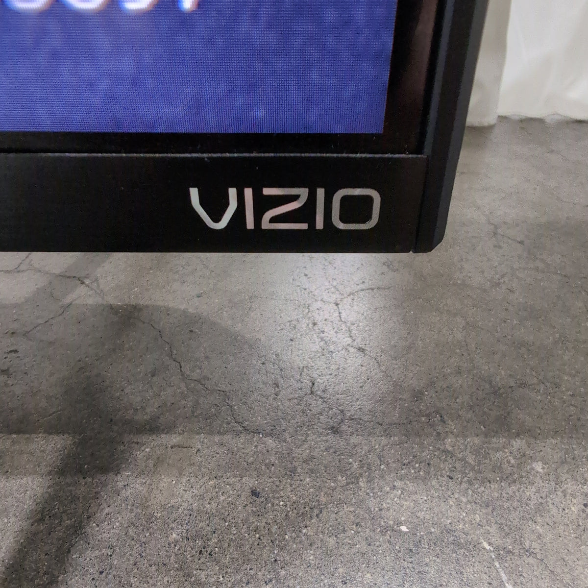 Large Black Flat Screen TV with Stand