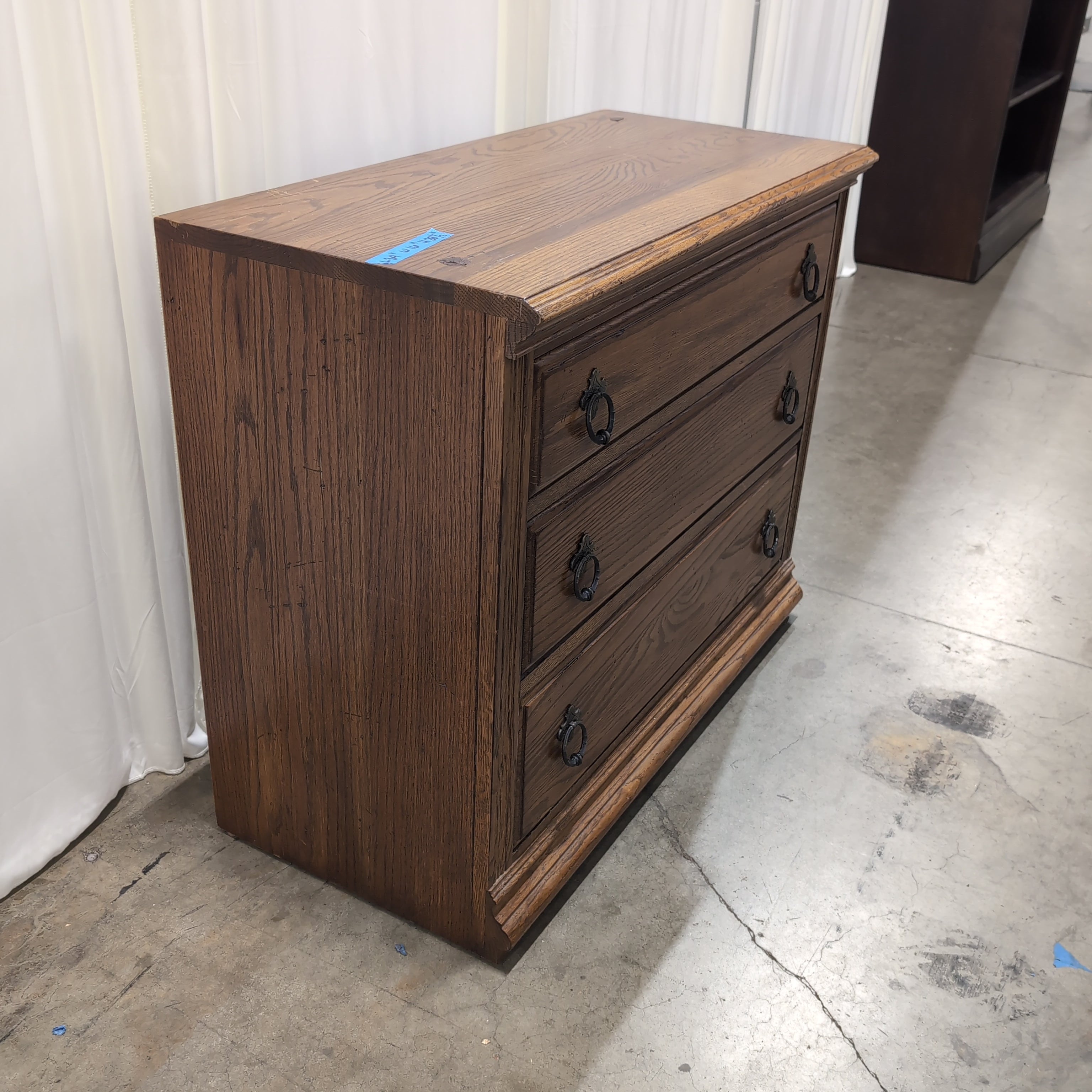 Traditional Brown Wood Three-Drawer Dresser with Ornate Hardware