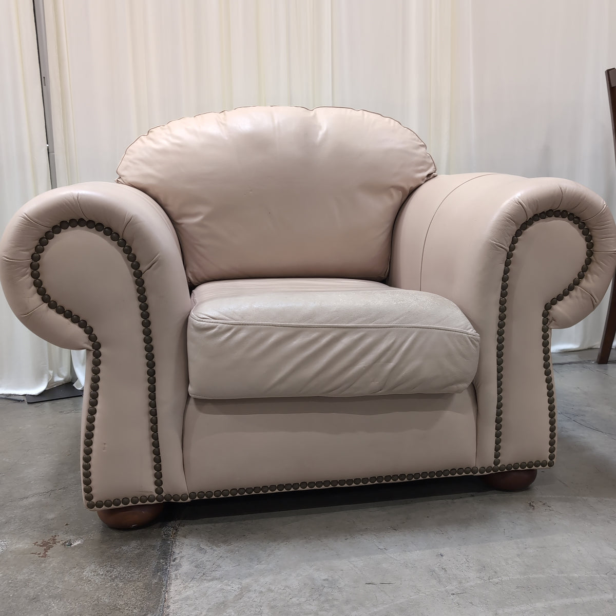 Padded Tan Armchair with Rolled Arms