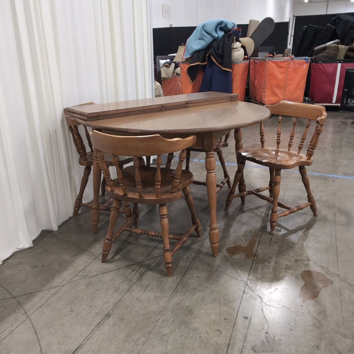 Round Medium Brown Wood Dining Table with Leaf Seam
