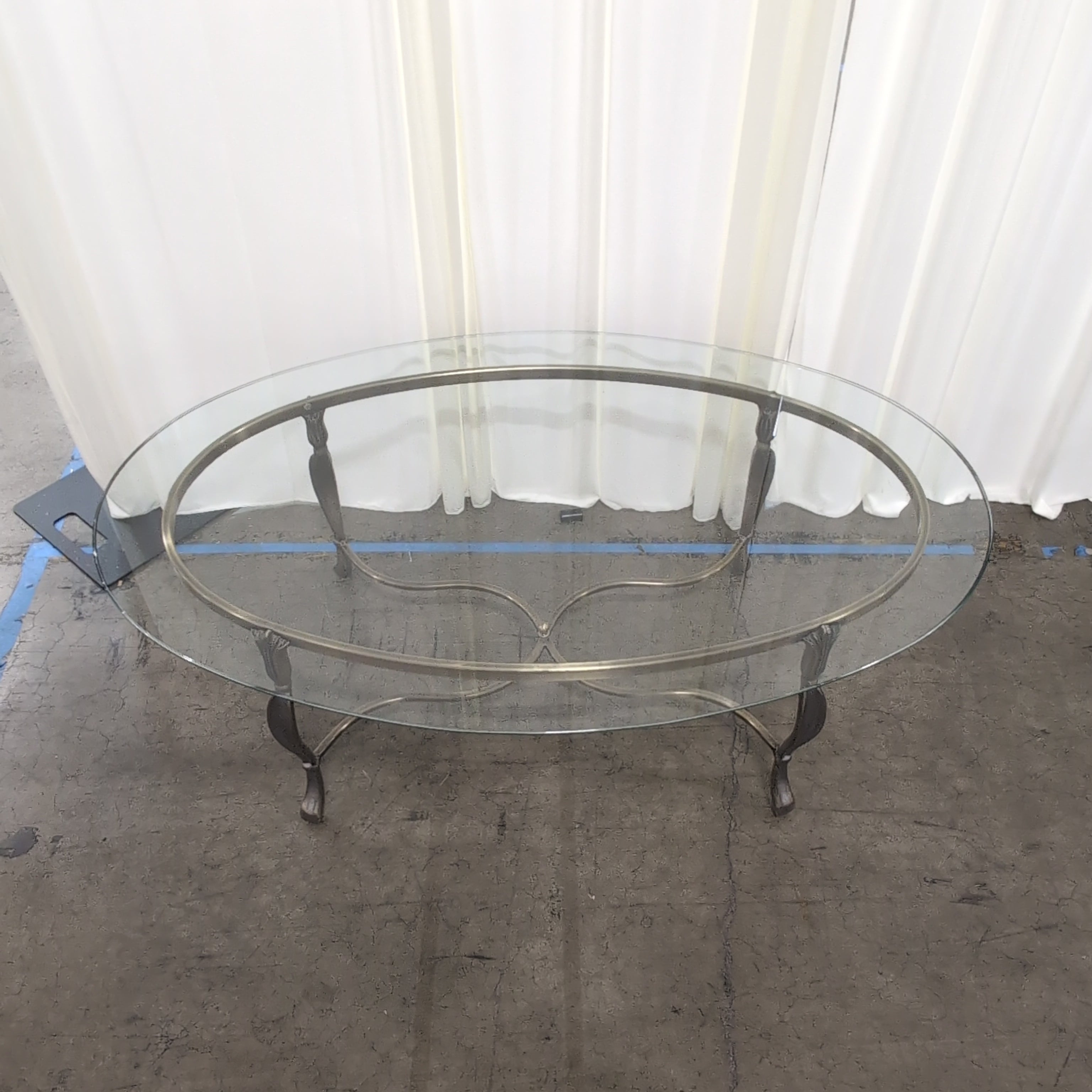 Oval Glass Coffee Table with Ornate Metal Base