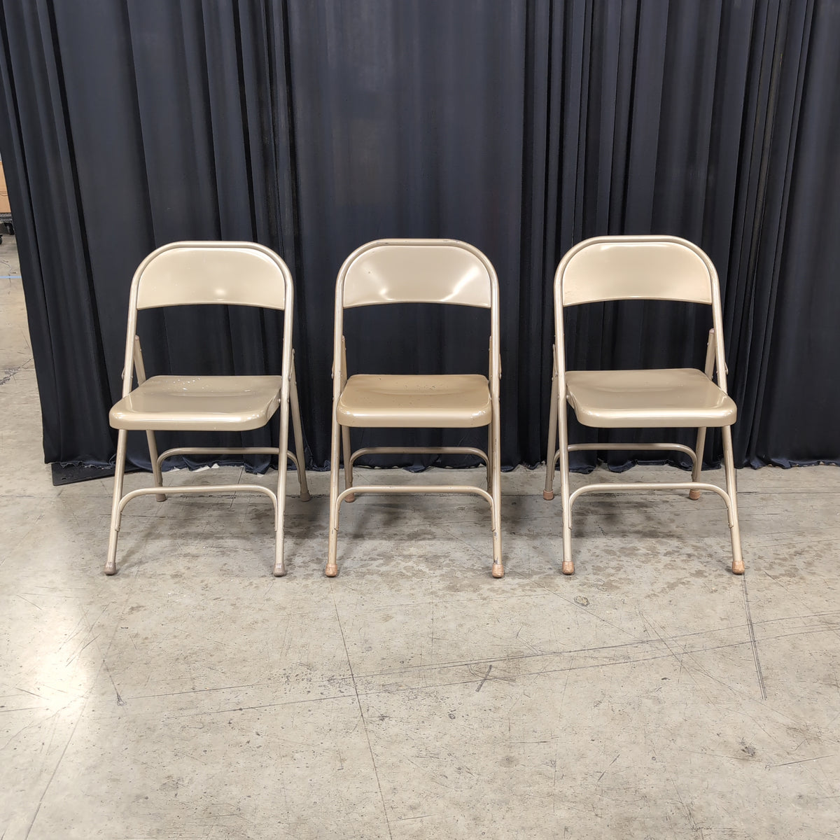 Set of Three Tan Metal Folding Chair with Rubber Feet