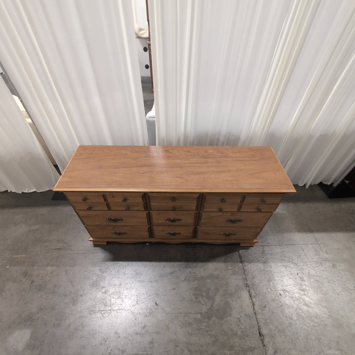 Traditional Brown Wood Nine-Drawer Dresser with Ornate Hardware