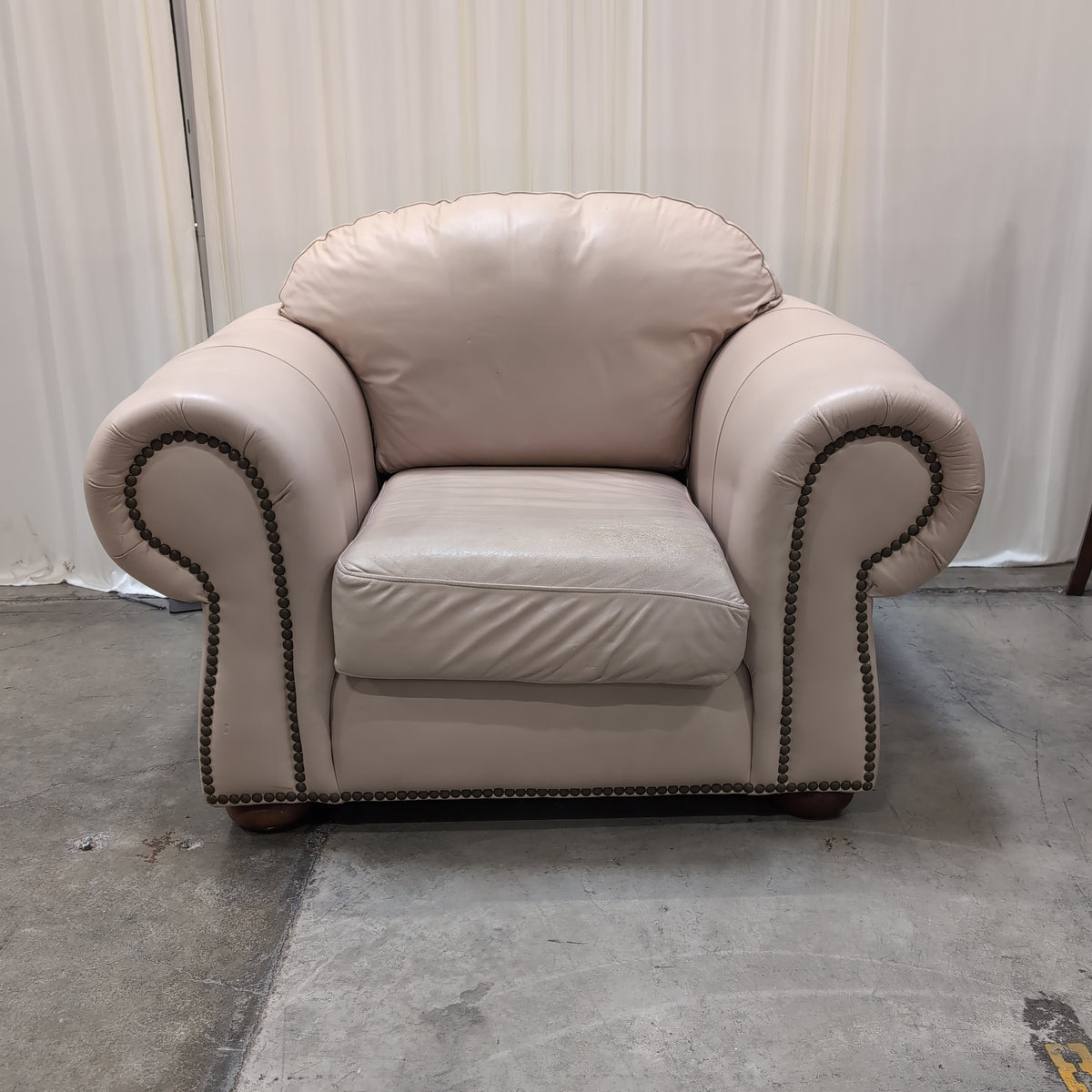 Padded Tan Armchair with Rolled Arms