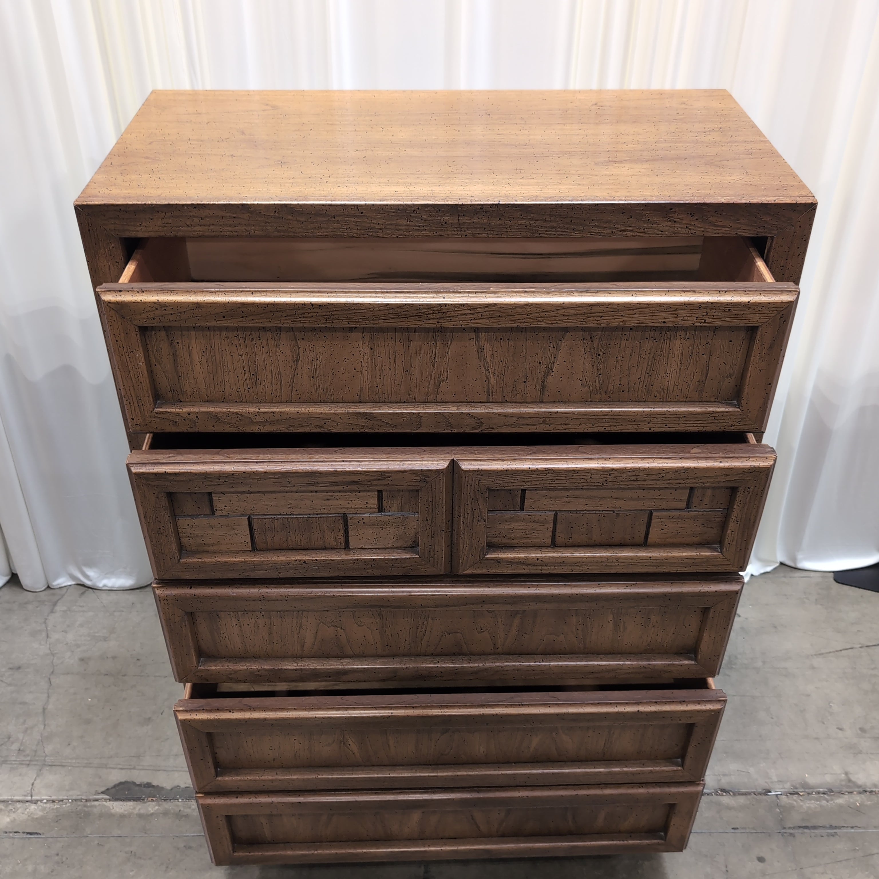 Honey Wood Five-Drawer Dresser with Geometric Top Panels