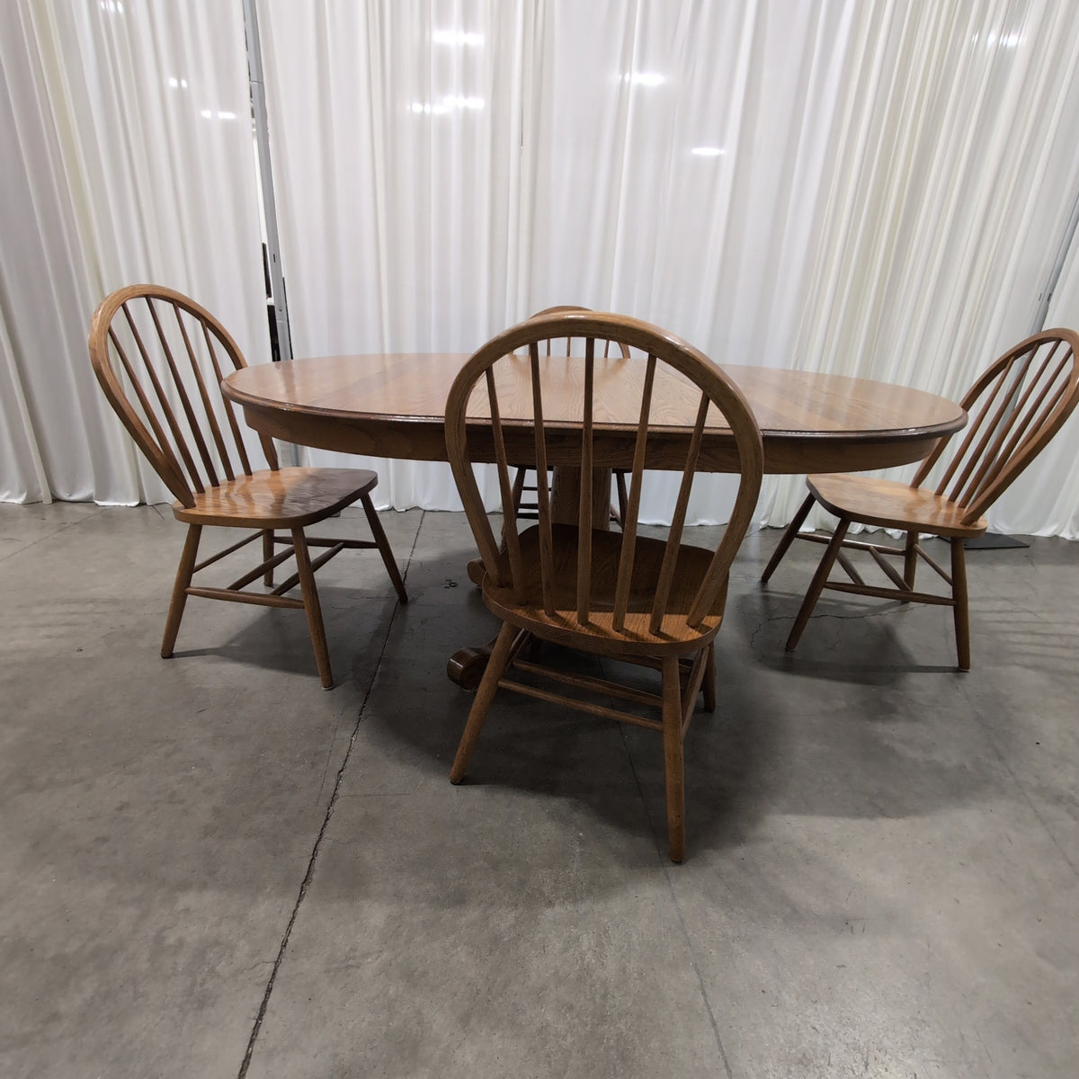 Oval Pedestal Wood Dining Table with Windsor Chairs
