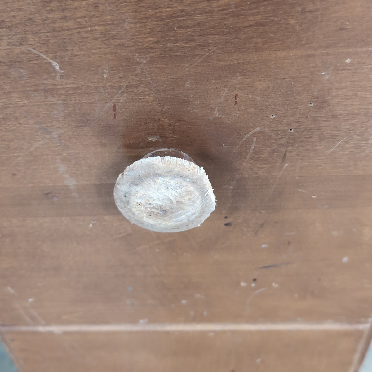 Brown Wood Four-Drawer Desk with Round Knobs