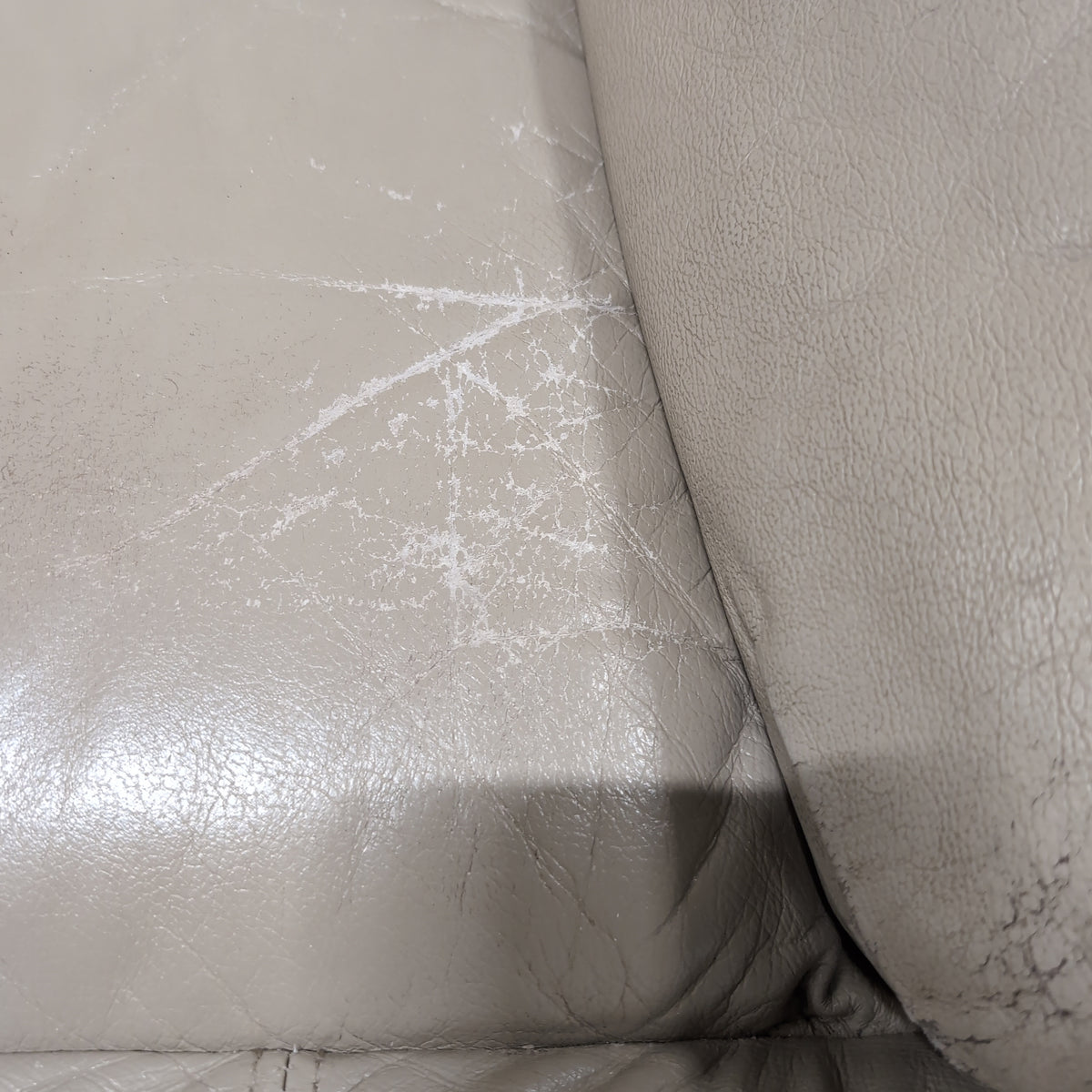 Overstuffed Light Beige Recliner in Leather