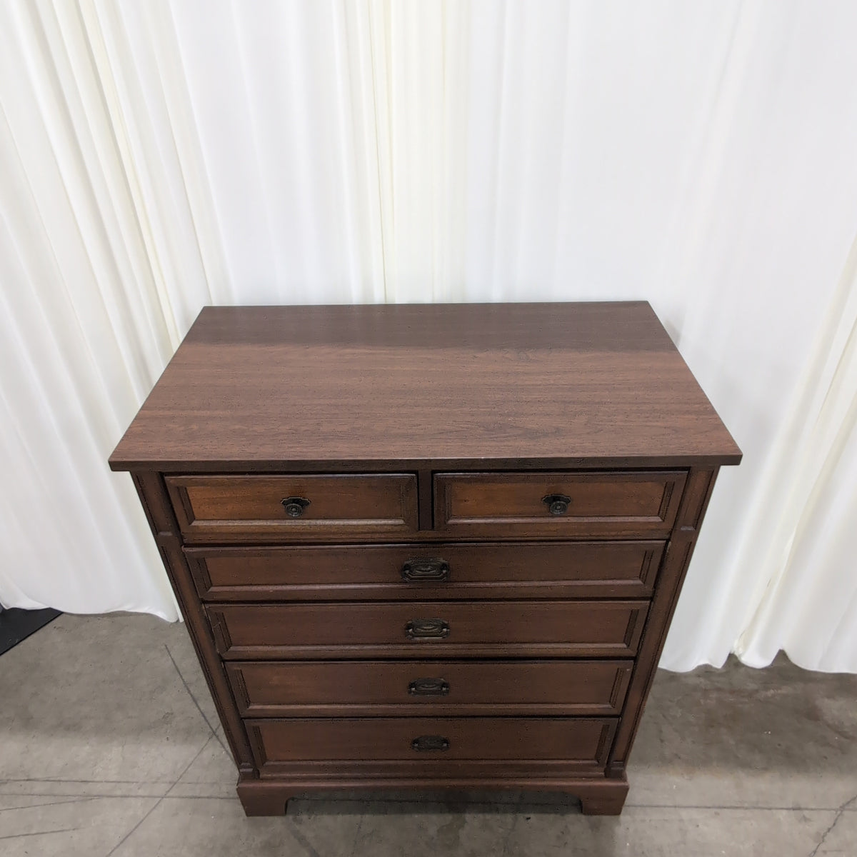 Brown Wood Six-Drawer Dresser with Ornate Hardware