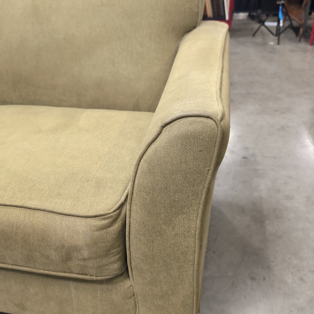 Tan Fabric Three-Cushion Couch with Rolled Arms