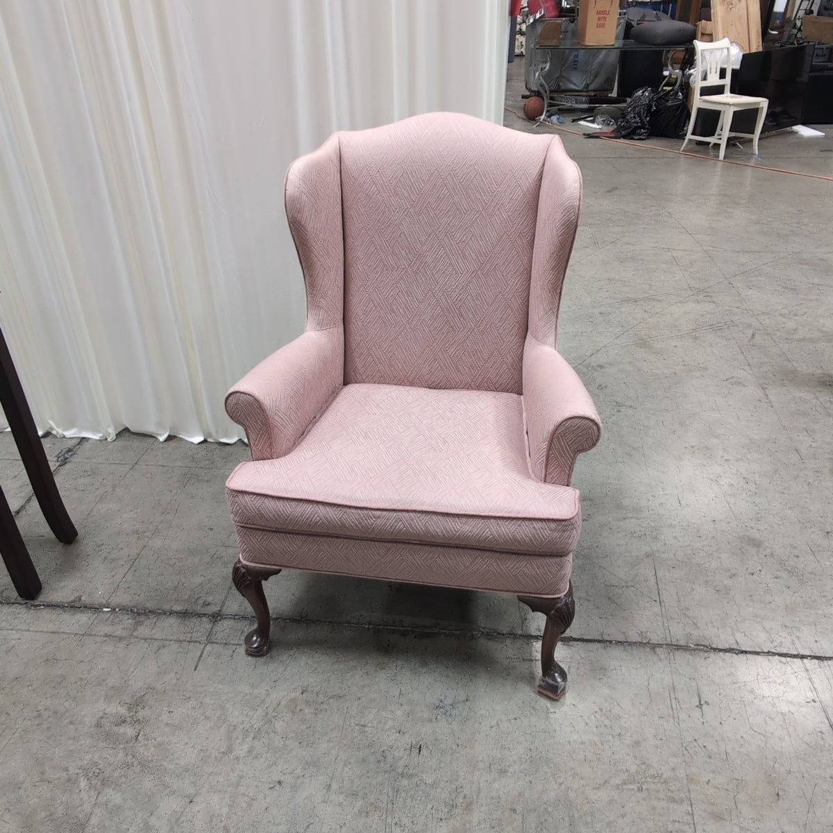 Mauve Upholstered Wingback Chair with Geometric Pattern