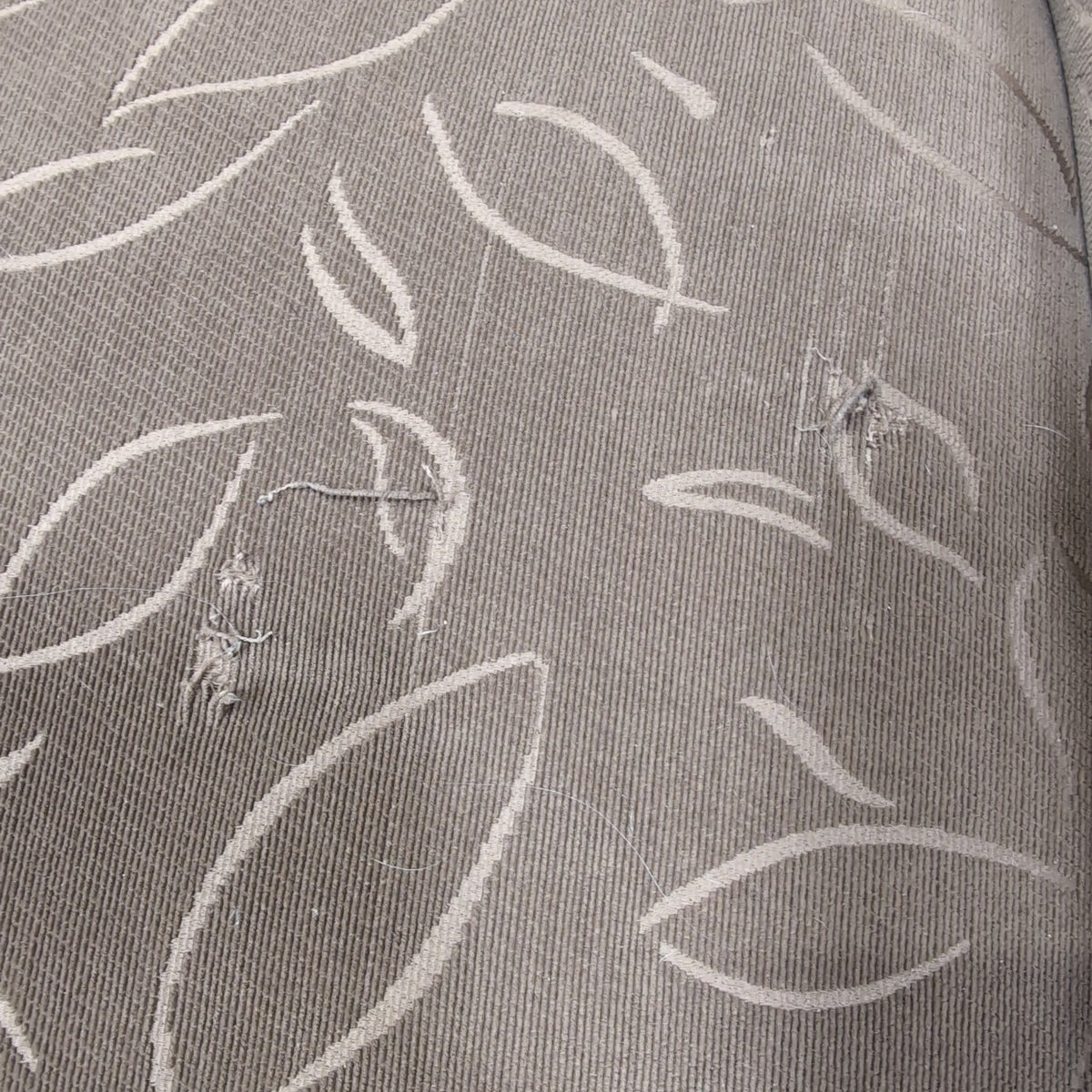 Tan Upholstered Chaise Lounge with Leaf Pattern