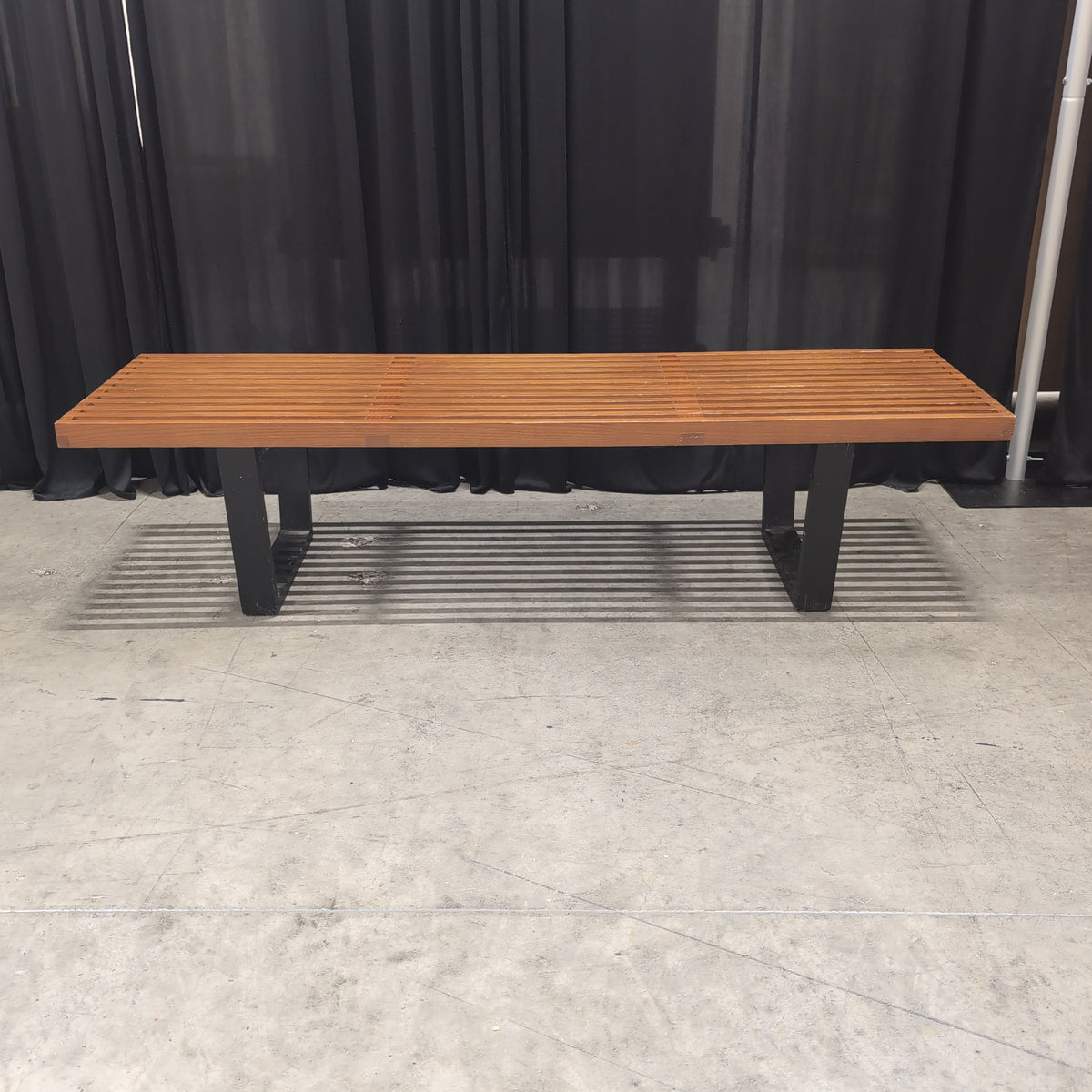 Brown Slatted Outdoor Bench in Hardwood