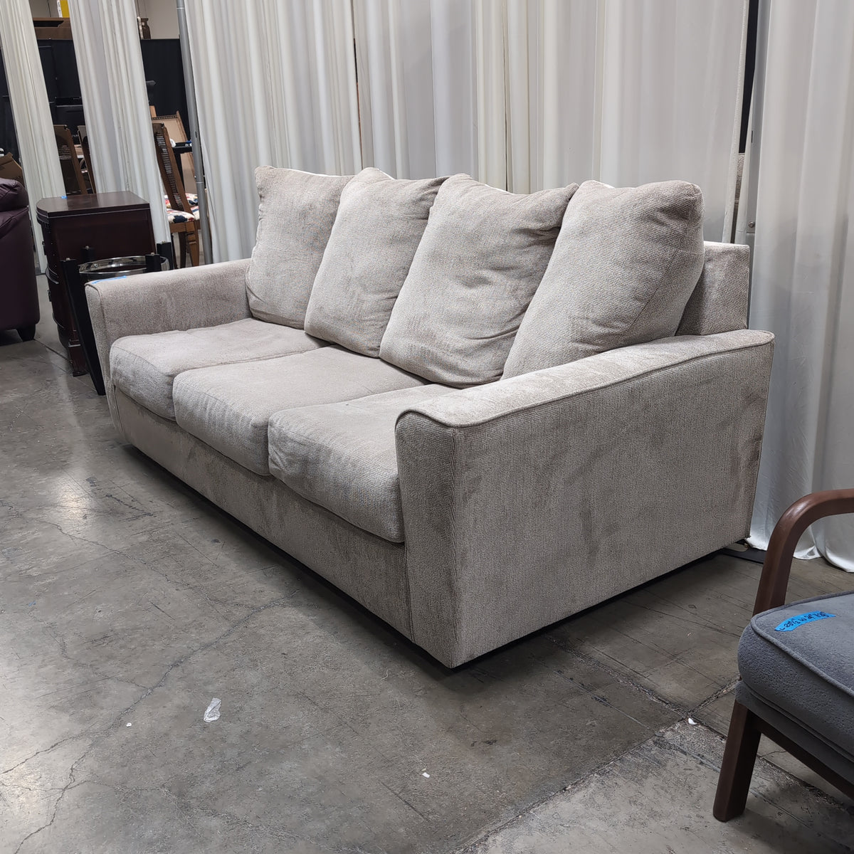 Light Beige Upholstered Three-Seat Couch