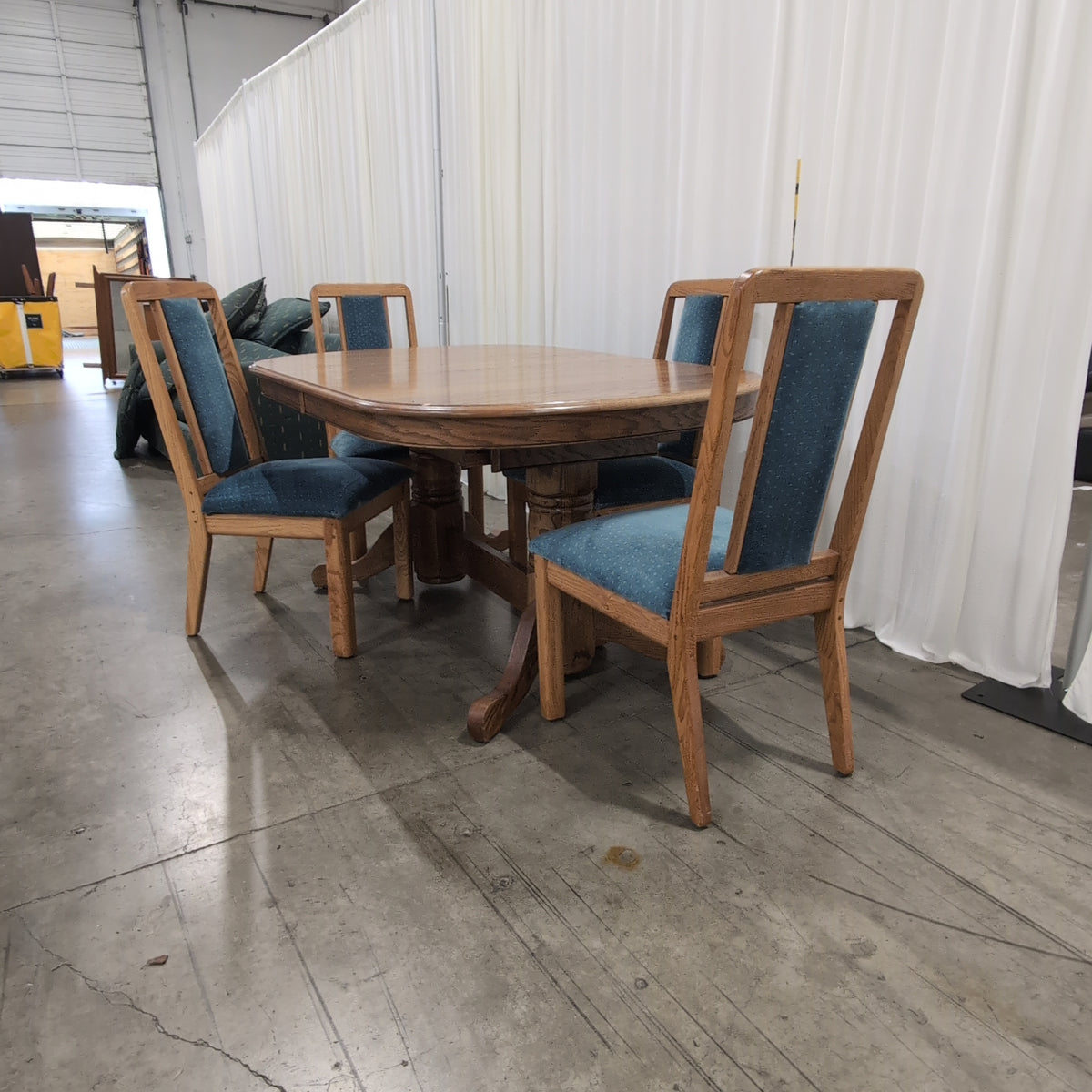 Reddish Brown Oval Pedestal Dining Table