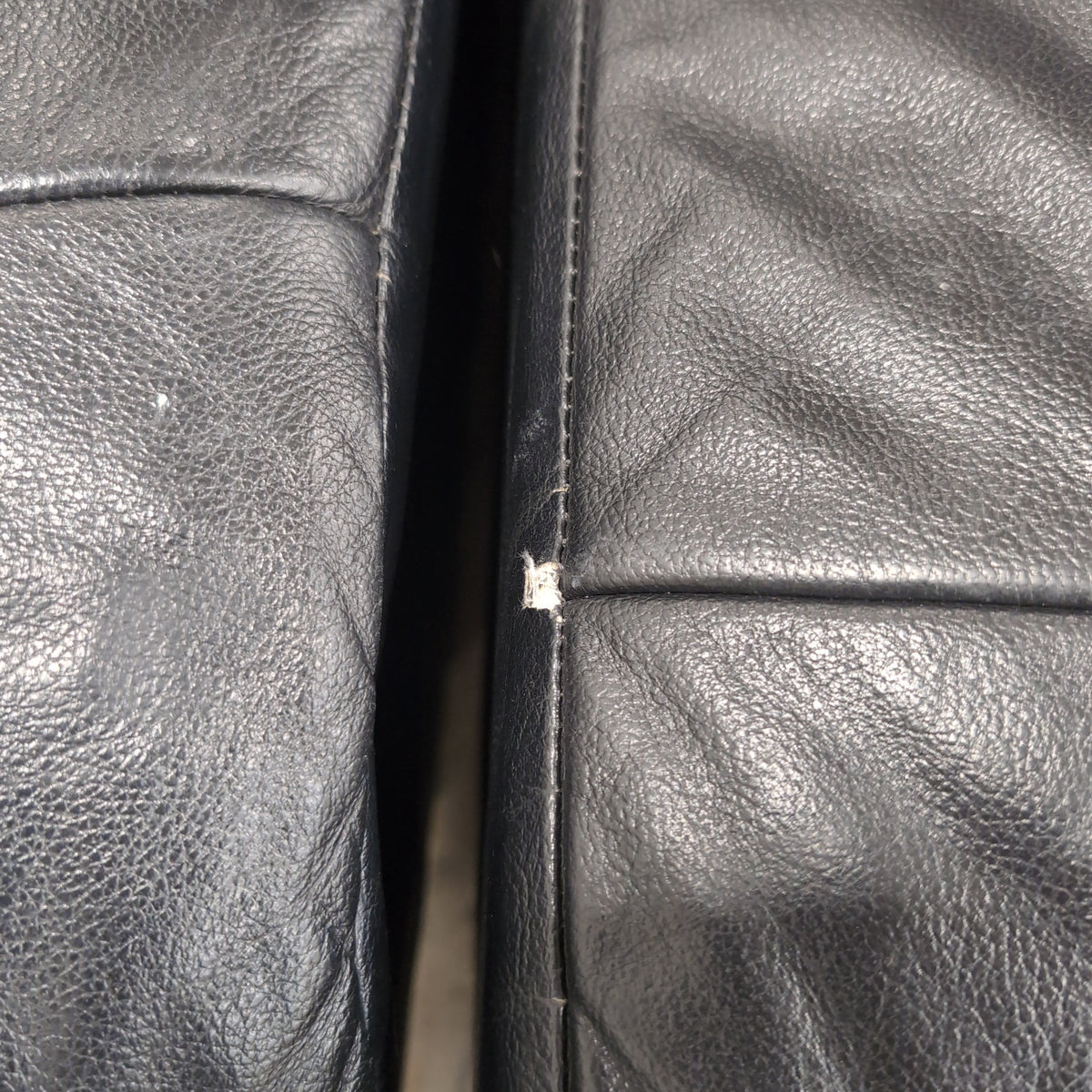 Black Tufted Leather Sectional Couch with Chrome Feet
