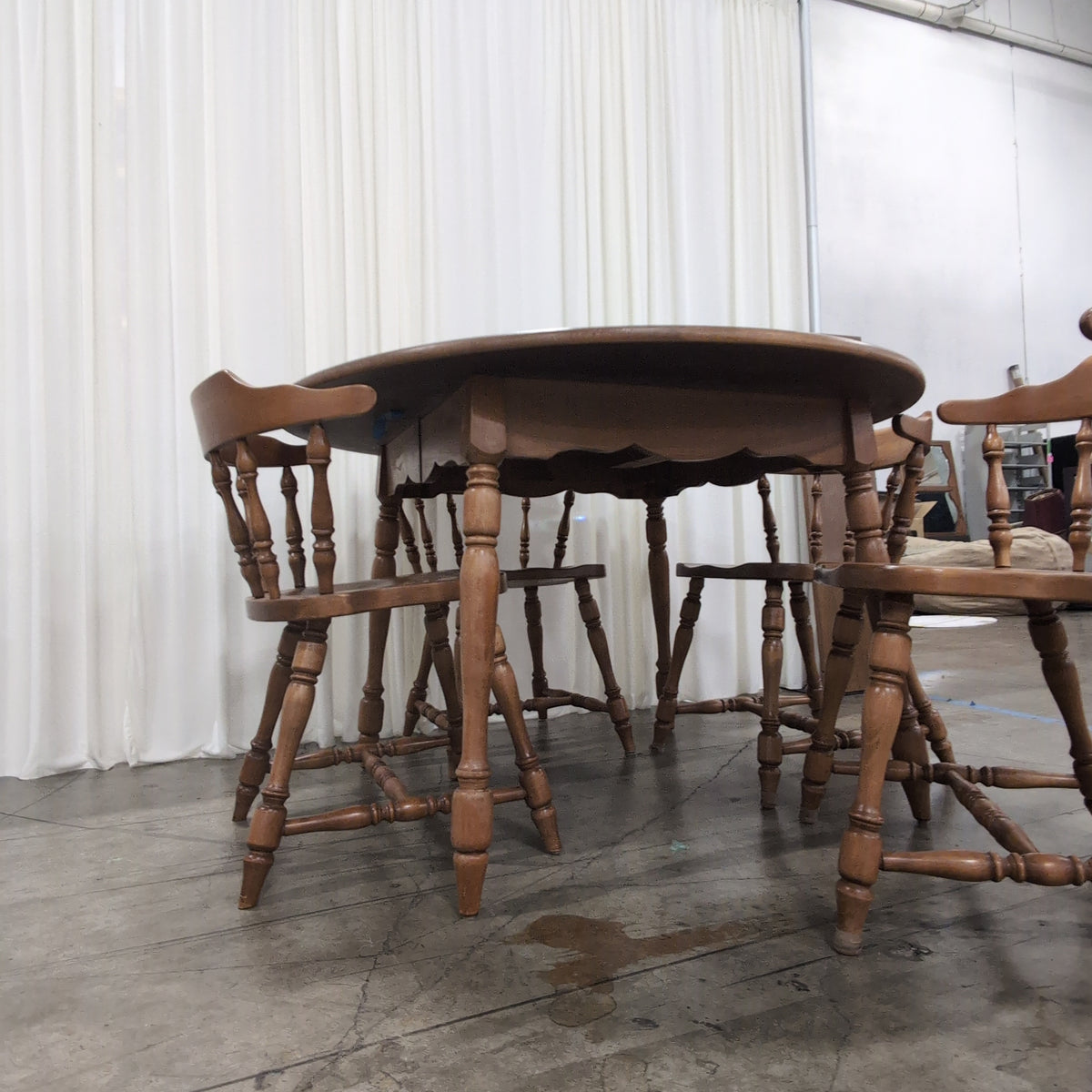 Round Medium Brown Wood Dining Table with Leaf Seam