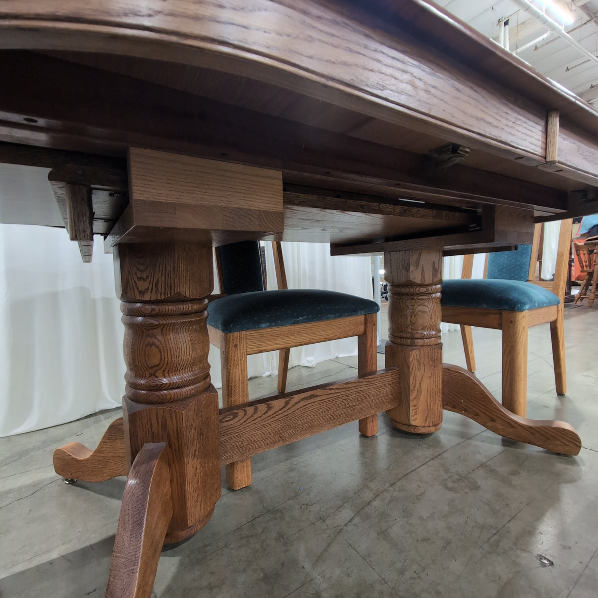 Reddish Brown Oval Pedestal Dining Table