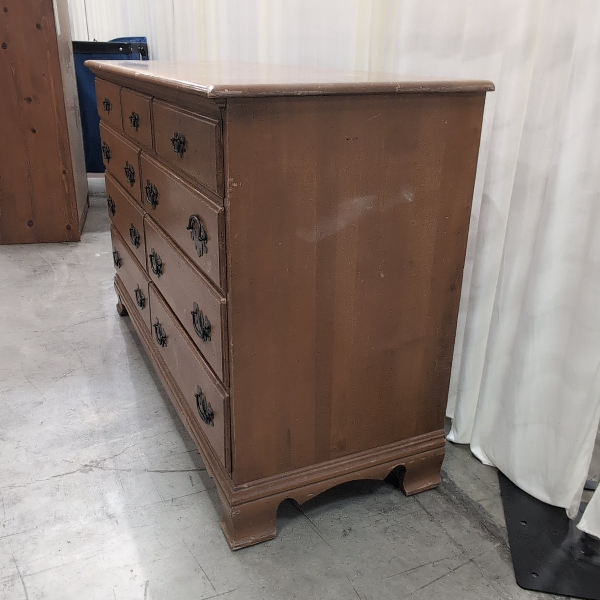 Traditional Honey Tone Nine-Drawer Dresser with Ornate Hardware