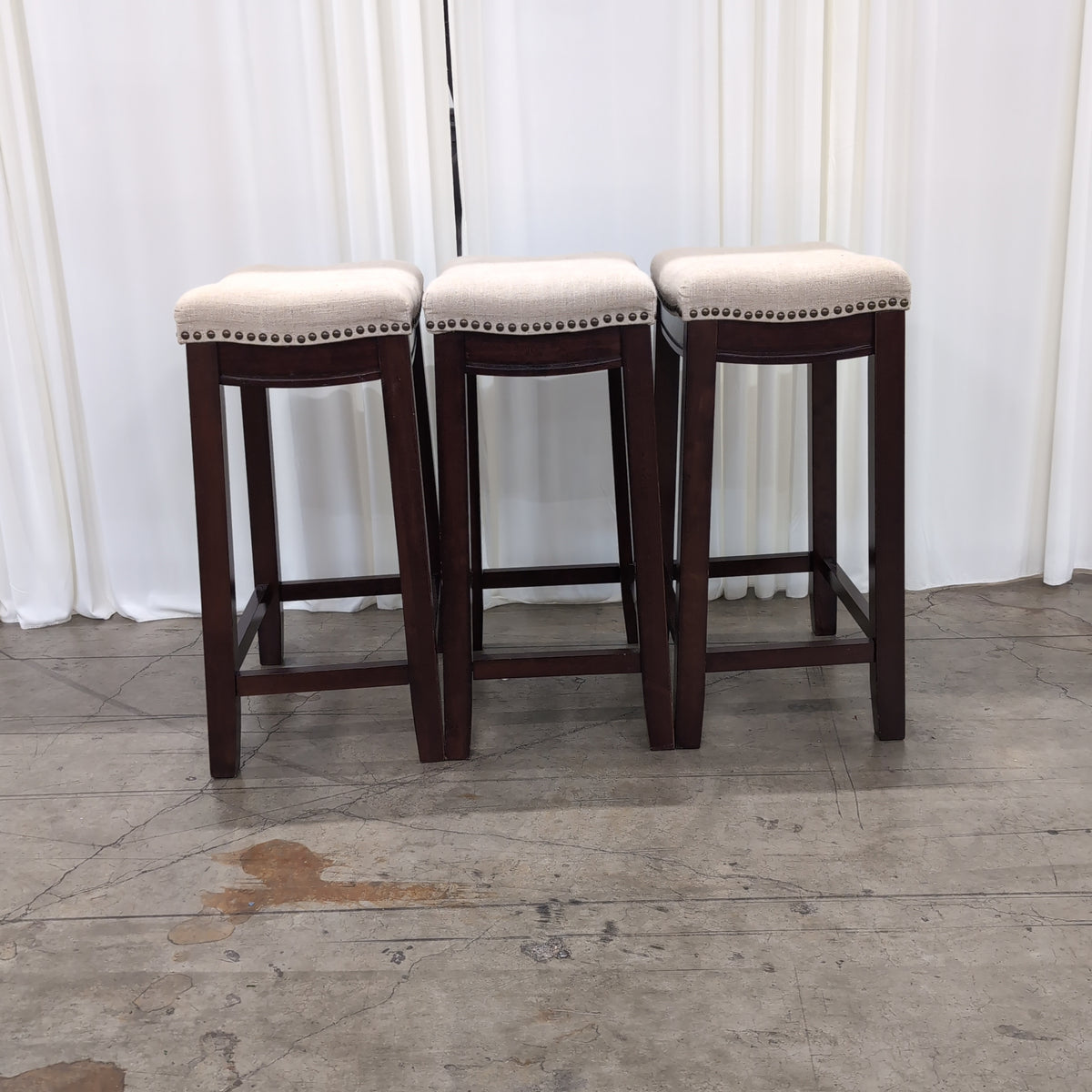 Set of Three Linon Home Products Upholstered Stools in Dark Wood