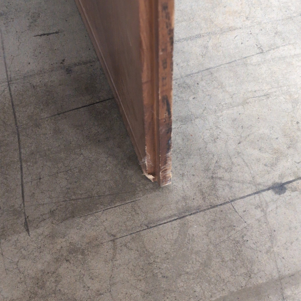 Brown Wood Four-Drawer Desk with Round Knobs