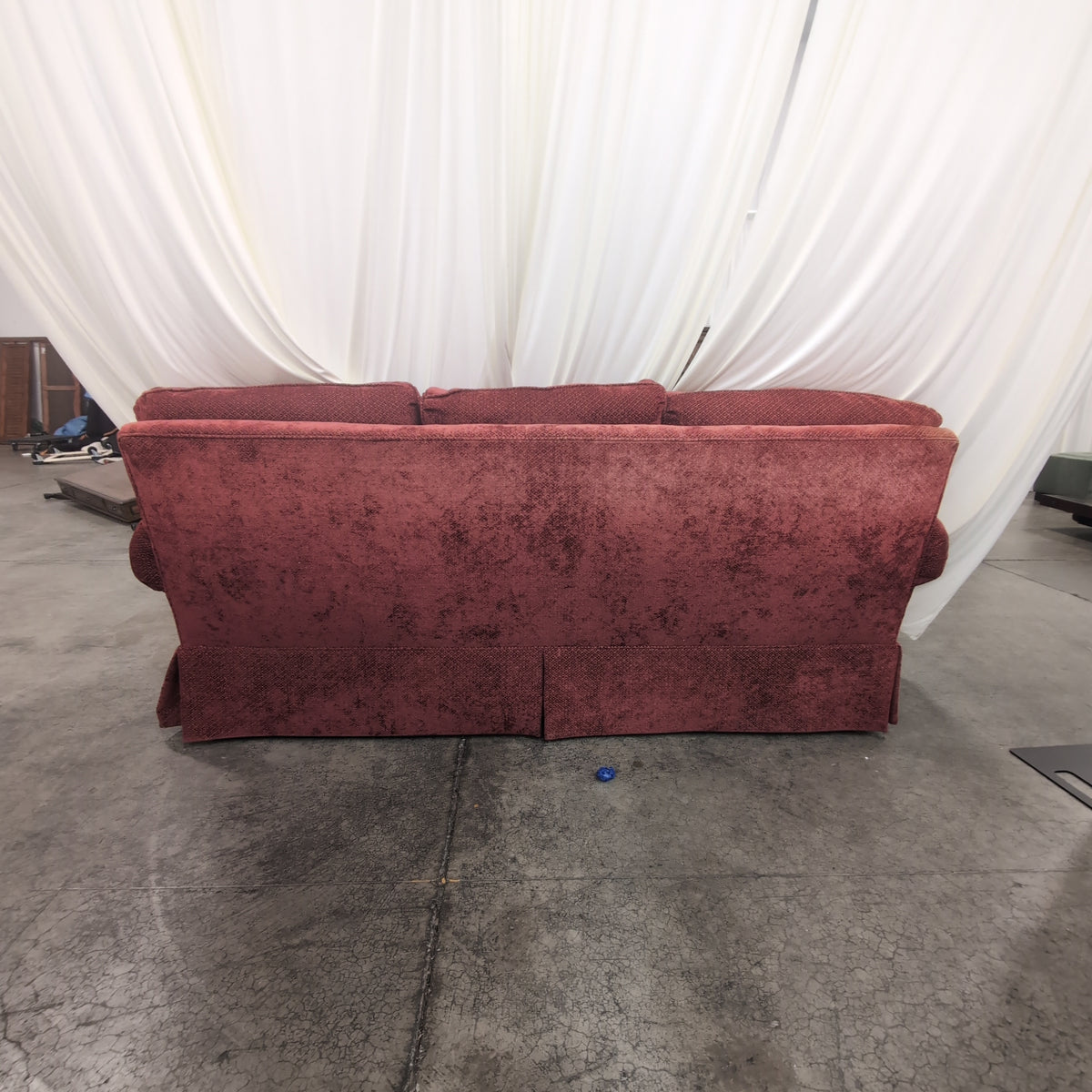 Deep Red Upholstered Three-Seat Couch