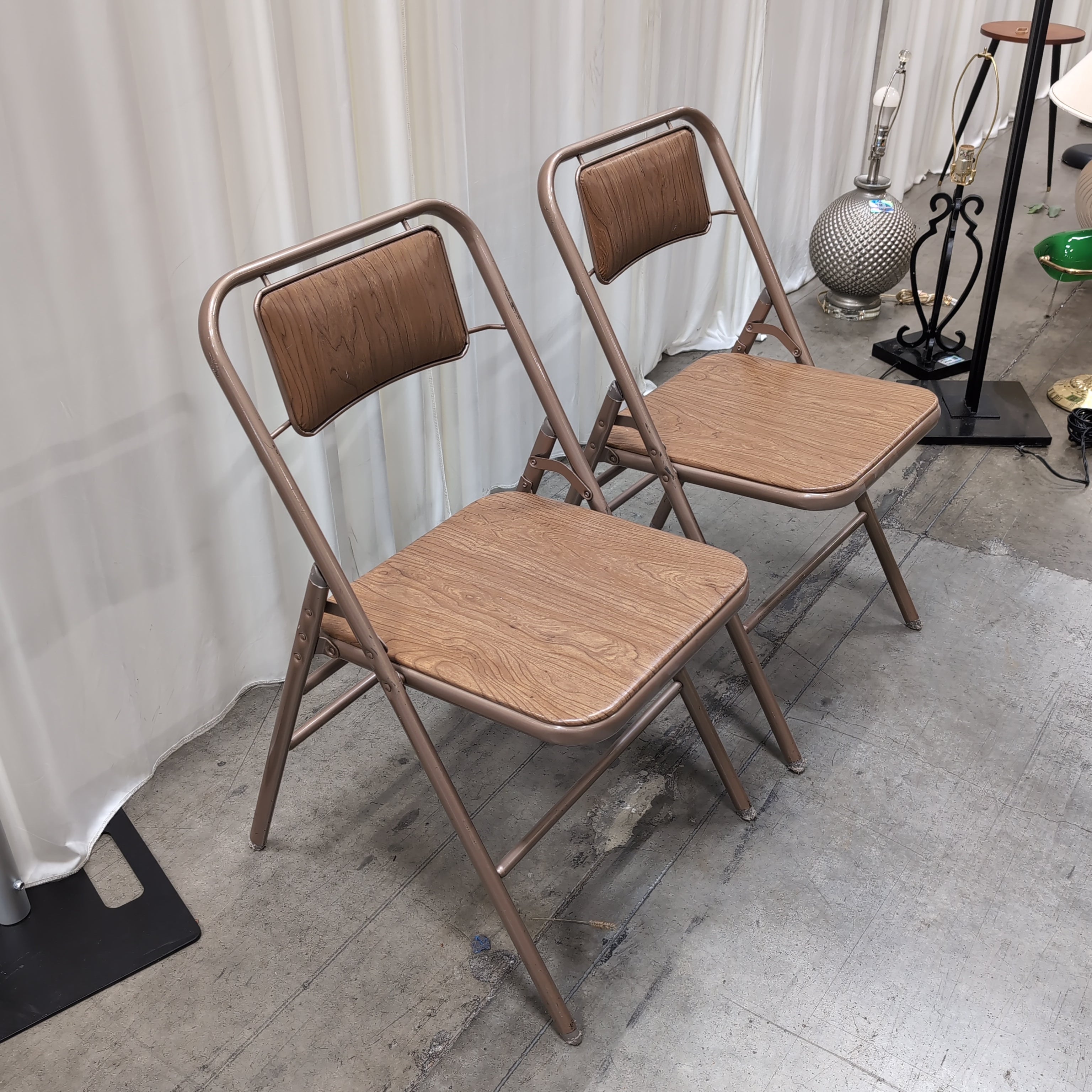Pair of Bronze Metal Folding Chairs with Wood-Look Seats