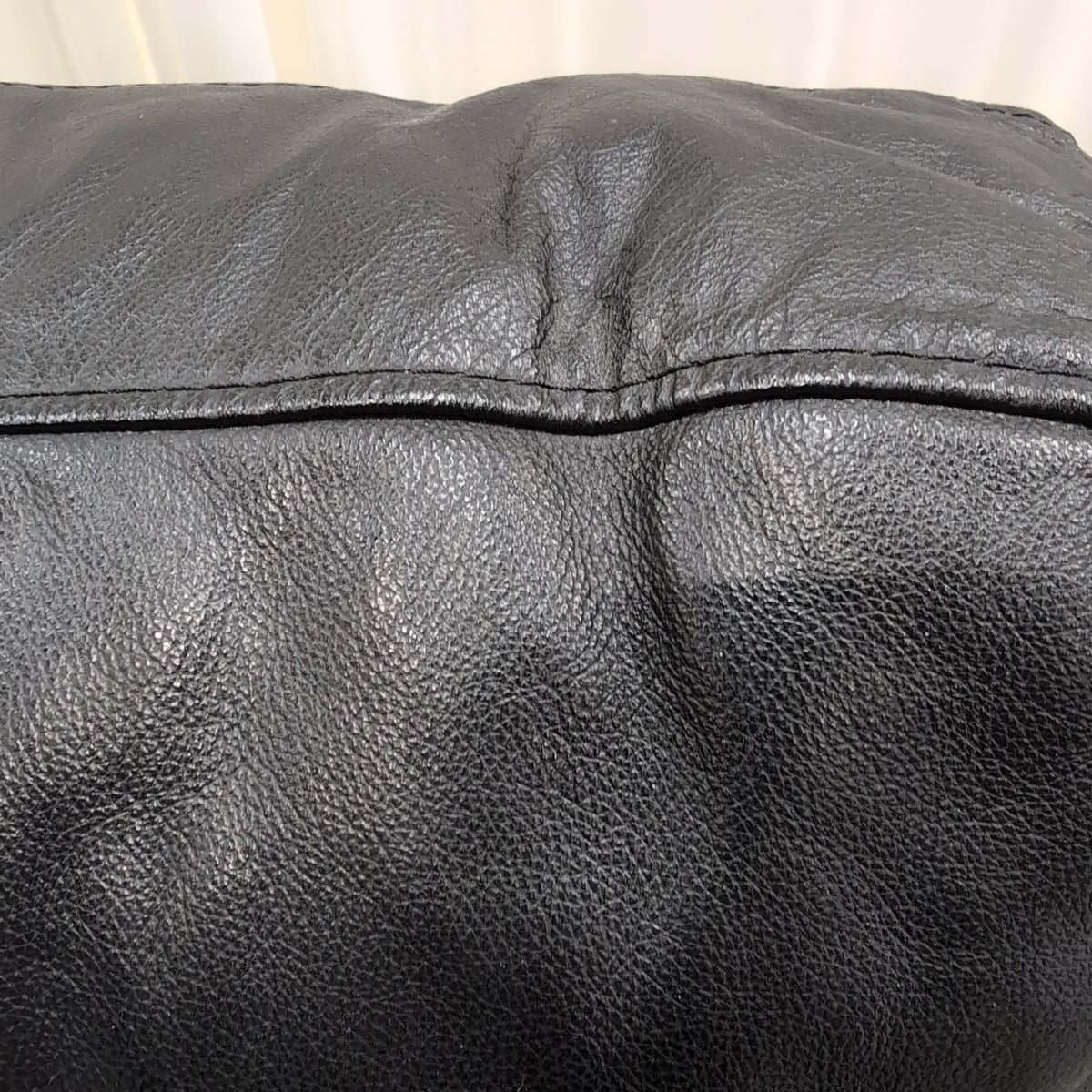 Black Leather Three-Seat Couch with Padded Arms