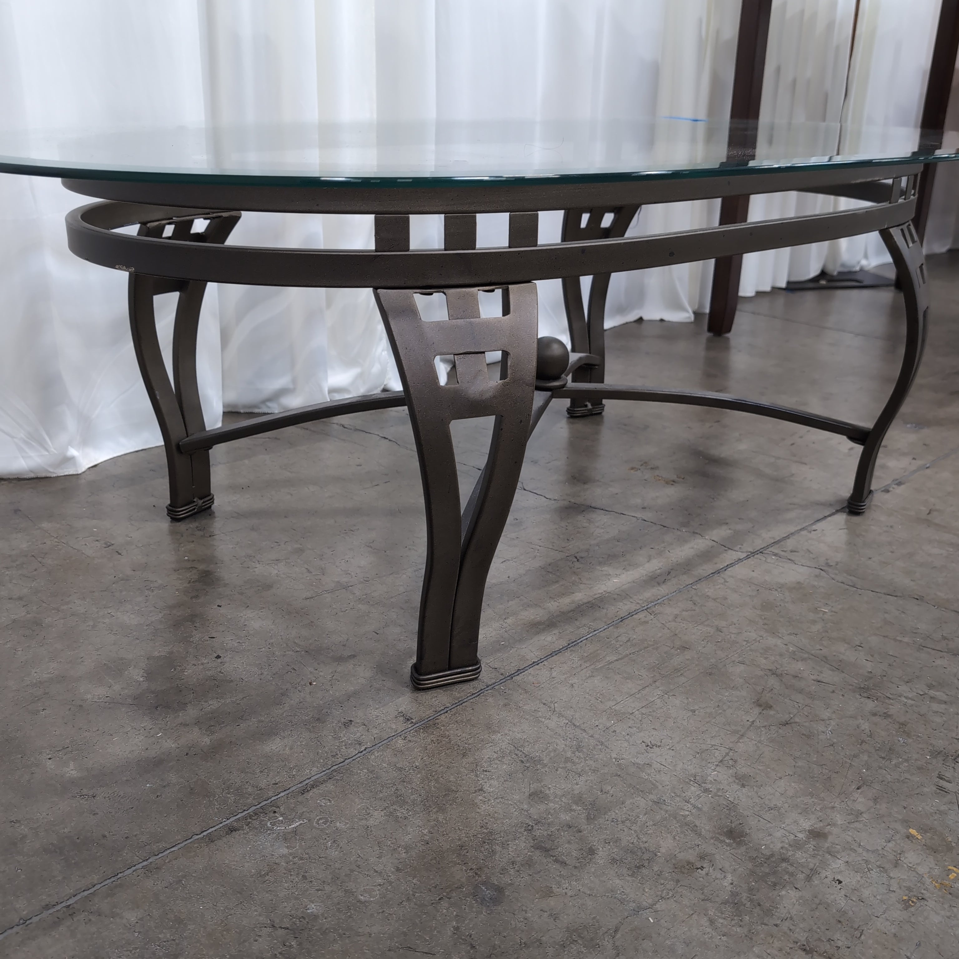 Oval Glass Coffee Table with Dark Metal Base