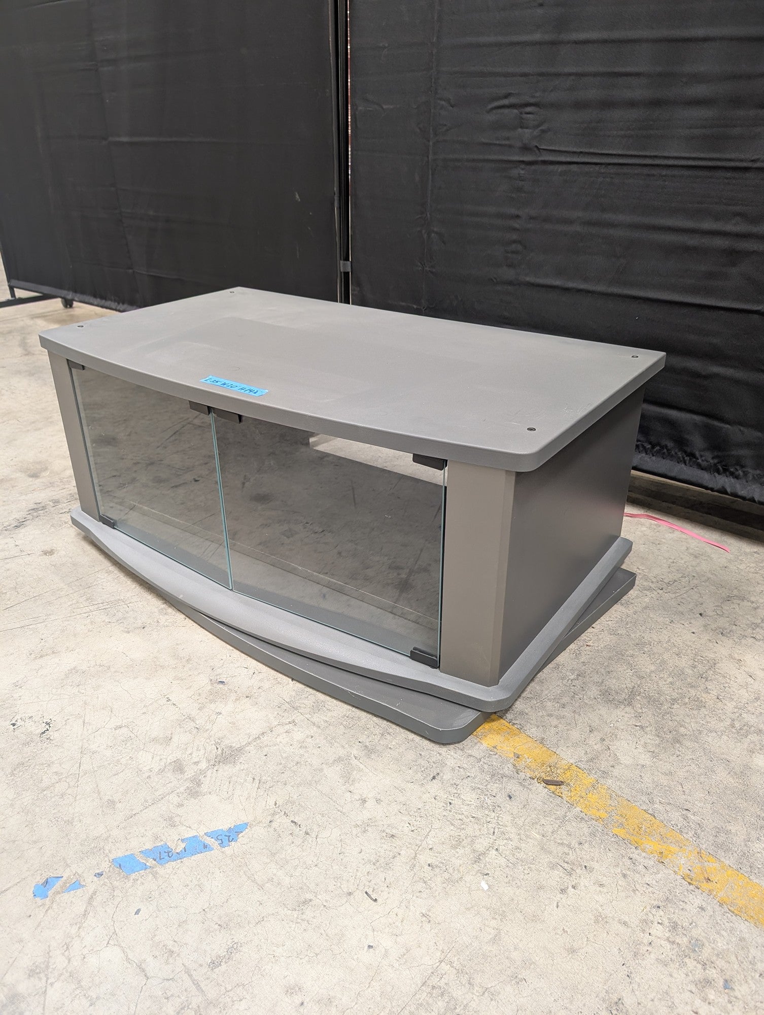 Gray Wood Composite TV Stand with Glass Doors
