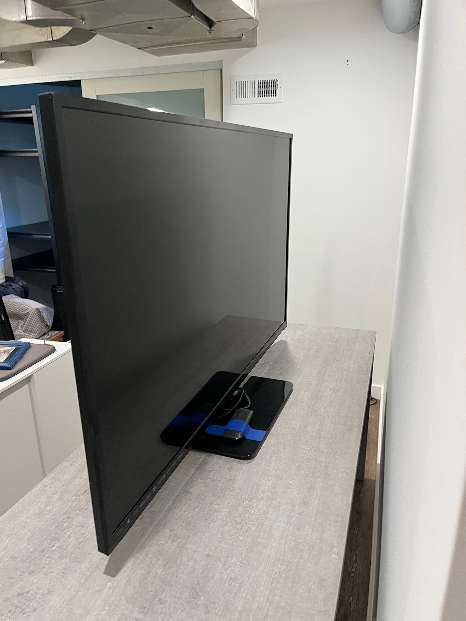 Black Flat Panel TV with Stand