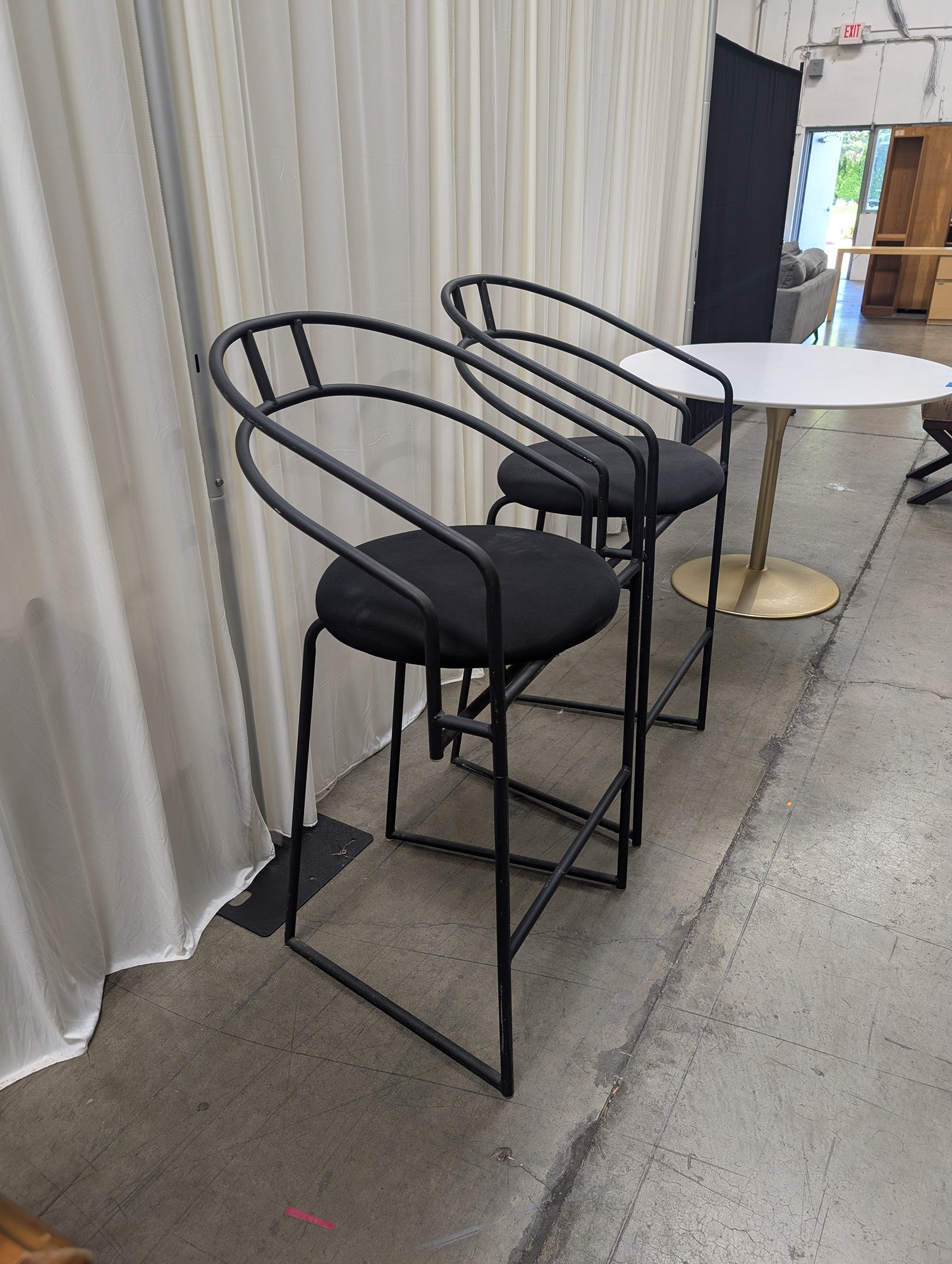 Pair of Modern Black Metal Bar Stools with Round Cushions